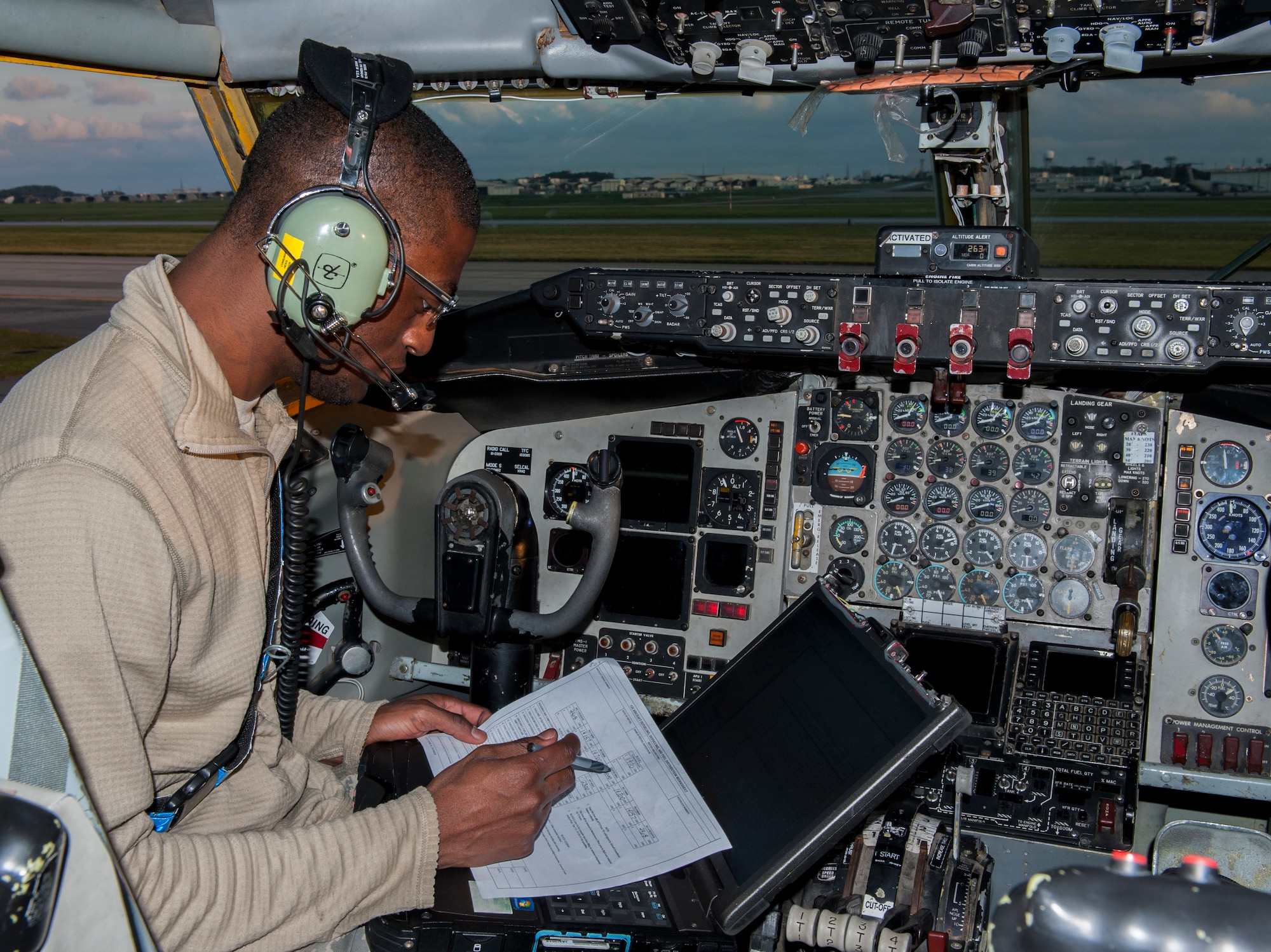 U.S. Air Force Senior Airman Jonathan Hicks, 909th Aircraft Maintenance Unit communications and navigations journeyman, works through his technical orders to prepare a KC-135 Stratotanker for refueling, Dec. 7, 2015, at Kadena Air Base, Japan. Technical orders ensure a safe and correctly executed job. (U.S. Air Force photo by Airman Zackary A. Henry)
