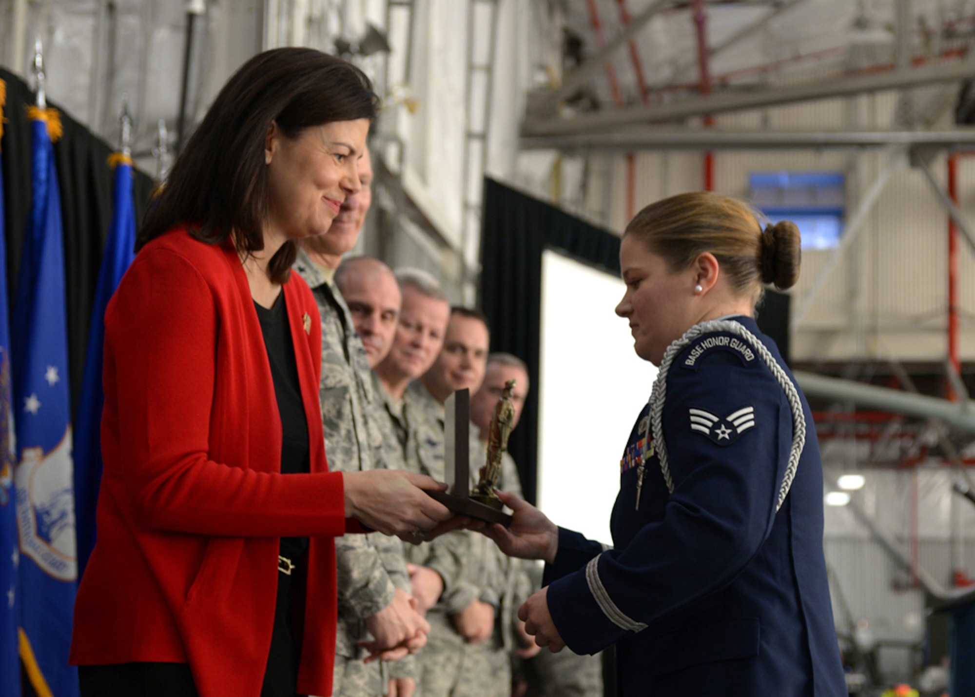 United States Senator Kelly Ayotte congratulates Senior Airman Sarah Laperle for winning the Honor Guard Member of the Year Award during the 157th Air Refueling Wing Commander's Call at Pease Air National Guard Base, N.H., Dec. 6, as senior leaders look on. Also named as award winners during the annual event were: Airman of the Year: Senior Airman Christopher S. Storm; NCO of the Year: Tech. Sgt. Amanda M. Bogue; Senior NCO of the Year: Master Sgt. Jay Gorsline; First Sergeant of the Year: Master Sgt. Jessica L. McWain; Company Grade Officer of the Year: Capt. Joseph A. Smith III; Spirit of Hope Award: Tech. Sgt. Kayla M. Carpenter; Honorary Recruiter of the Year Award: Airman 1st Class Jesse Bornkessel. (U.S. National Guard photo by Airman 1st Class Ashlyn Correia)
