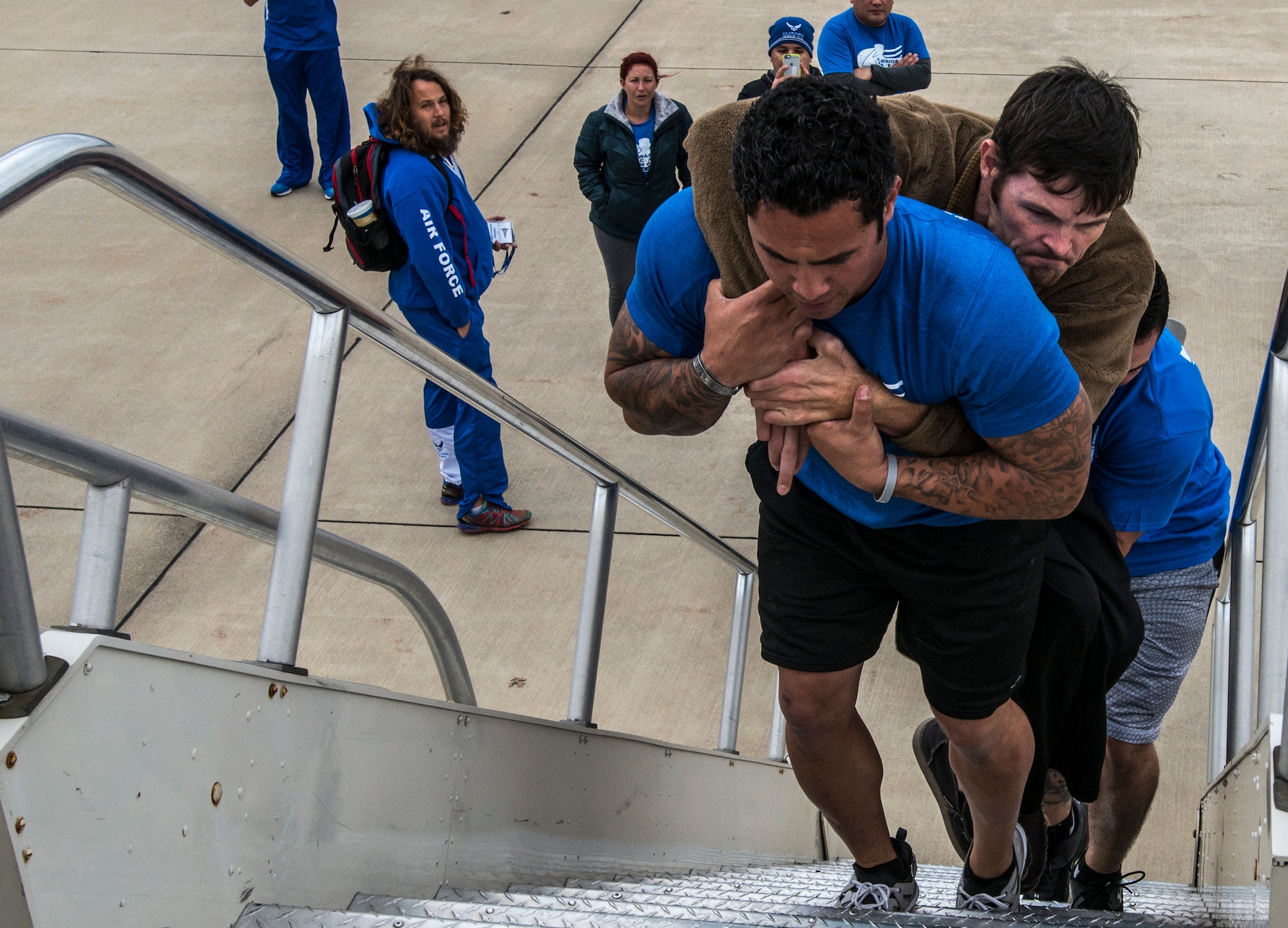 Tech. Sgt. Chris Ferrell, 11th Civil Engineer Squadron's
Explosive Ordnance Disposal flight, carries 1st Lt. Nathan Nelson, up a
flight of stairs so they can tour an 89th Airlift Wing C-32A at Joint Base
Andrews, Md. Nelson was hit with a 107mm rocket in Afghanistan and is
paralyzed. Ferrell was also wounded while disarming a road-side bomb in
Afghanistan and will be pinned with a Purple Heart Medal during an NFL
half-time show by Maj. Gen. Darryl Burke, Air Force District of Washington
commander, during the Redskins vs. Cowboys game, Dec. 7, 2015. (U.S. Air
Force photo by Senior Master Sgt. Kevin Wallace/RELEASED)
