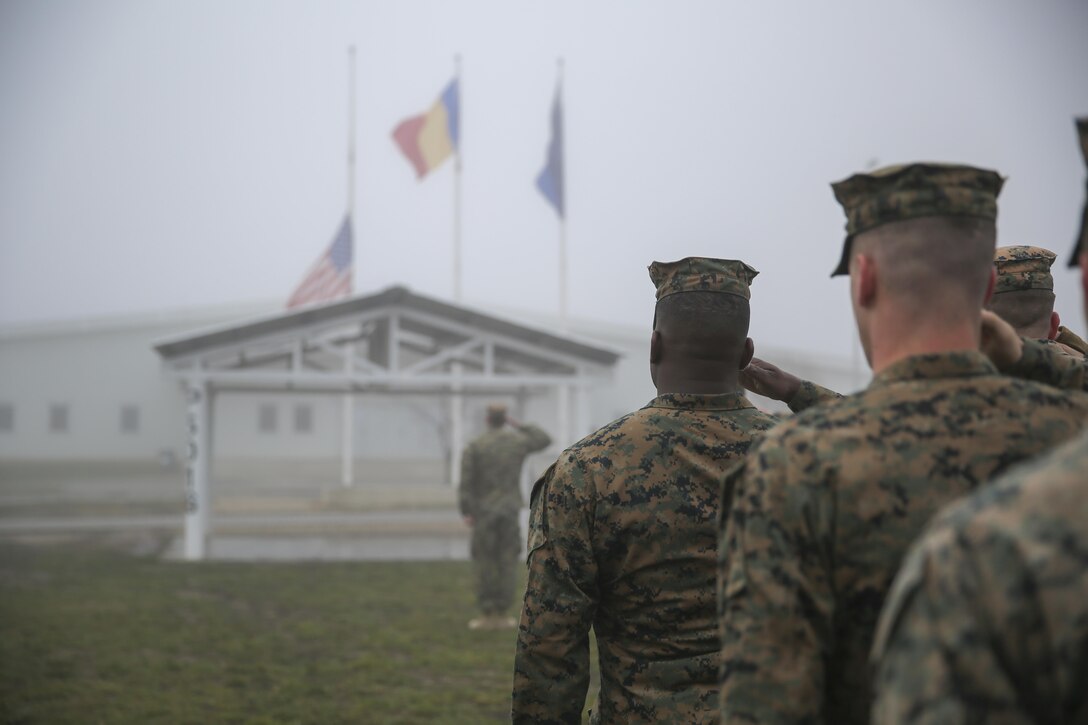 U.S. Marines render honors alongside Romanian soldiers to mark the 74th anniversary of the attack on Pearl Harbor during a ceremony  on Mihail Kogalniceanu Air Base, Romania, Dec. 7, 2015. The Marines are assigned to Black Sea Rotational Force. U.S. Marine Corps photo by Cpl. Kaitlyn V. Klein 