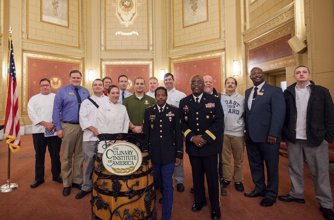 Army Brig. Gen. Richard B. Dix poses with current students and instructors at the Culinary Institute of America in Hyde Park, N.Y.  
 
