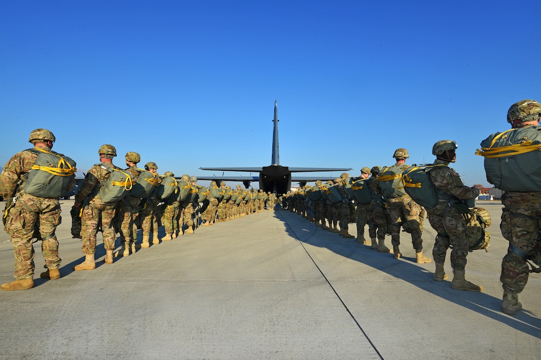 U.S. paratroopers prepare to board a U.S. Air Force C-130 Hercules aircraft on Aviano Air Base, Italy, Dec. 2, 2015. U.S. Army photo by Paolo Bovo