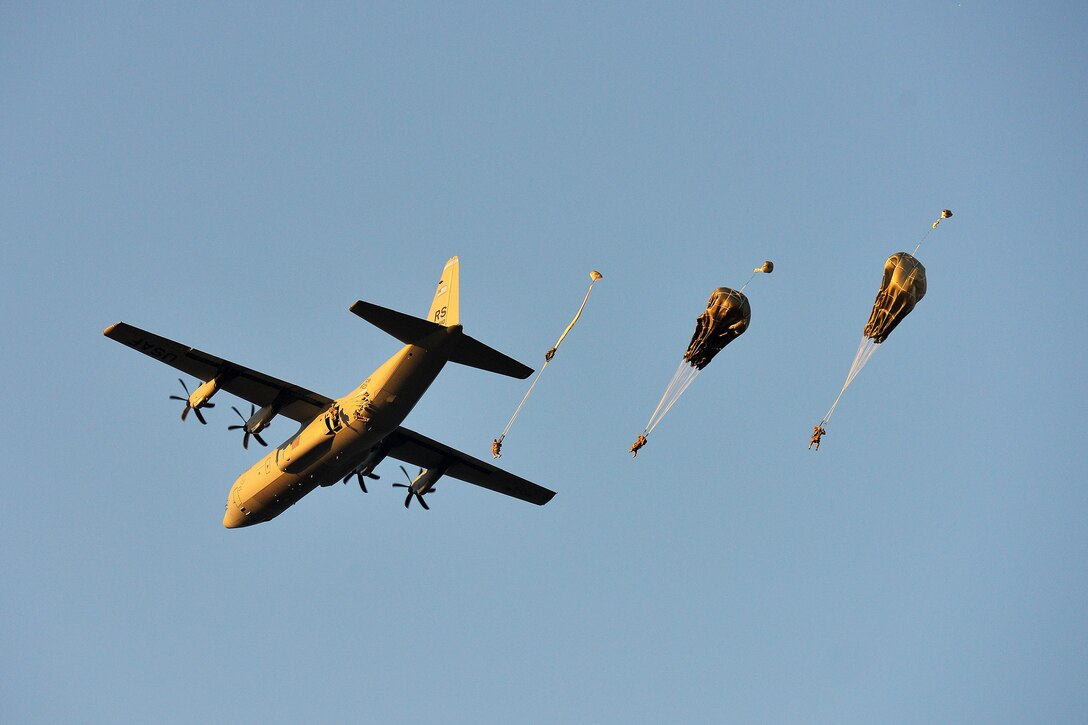 U.S. paratroopers conduct airborne operations from a U.S. Air Force C-130 Hercules aircraft over Juliet drop zone in Pordenone, Italy, Dec. 2, 2015. U.S. Army photo by Paolo Bovo