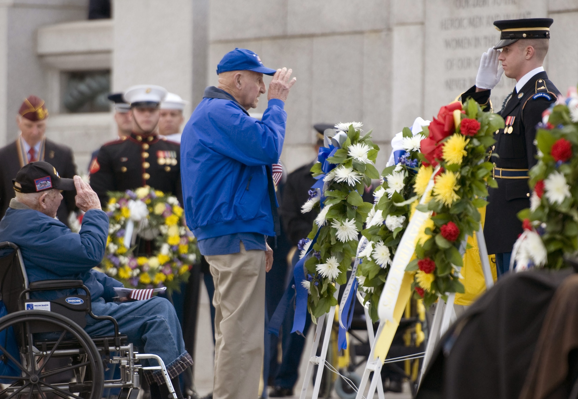 Two World War II veterans render a salute after laying a wreath during a Pearl Harbor remembrance ceremony at the National WWII Memorial on Dec. 7, 2015, in Washington, D.C. (U.S. Air Force photo/Sean Kimmons)