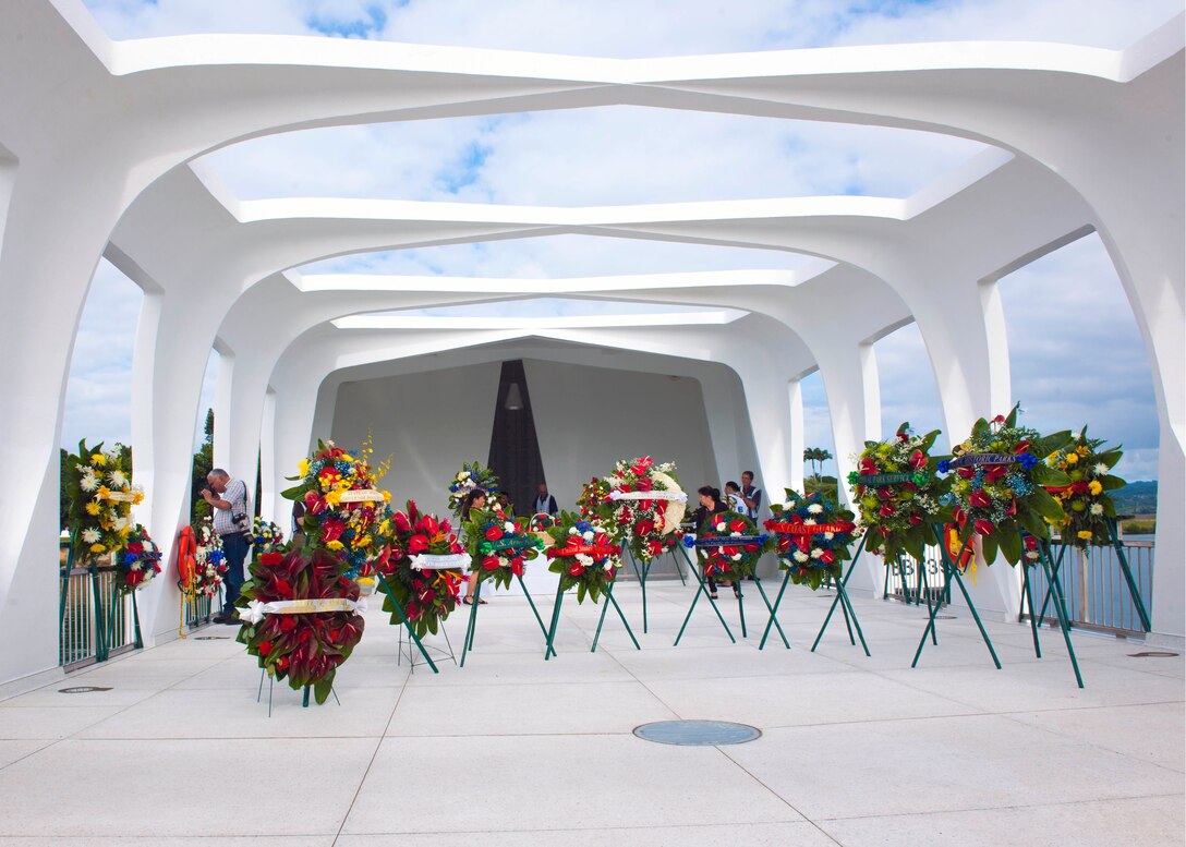 Wreaths adorn the USS Arizona Memorial on Joint Base Pearl Harbor-Hickam, Hawaii, Dec. 7, 2015, where a remembrance ceremony was held to honor survivors and those who lost their lives in the attacks on Pearl Harbor 74 years ago. U.S. Navy photo by Petty Officer 2nd Class Jeff Troutman