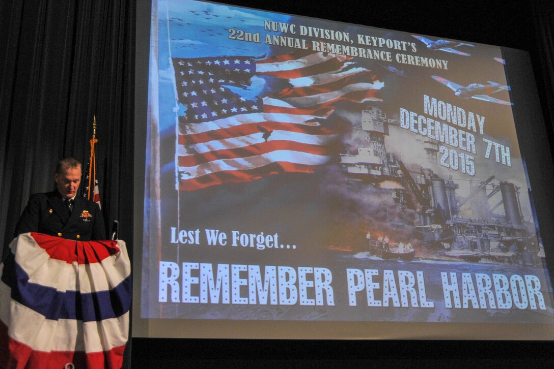 Navy Capt. Francis Spencer, commander, Naval Undersea Warfare Center Division Keyport, delivers the Pearl Harbor Remembrance ceremony narration in Naval Undersea Museum Jack Murdock Auditorium during the command's annual Pearl Harbor Remembrance ceremony in Keyport, Wash., Dec. 7, 2015. U.S. Navy photo by Petty Officer 3rd Class Charles D. Gaddis IV