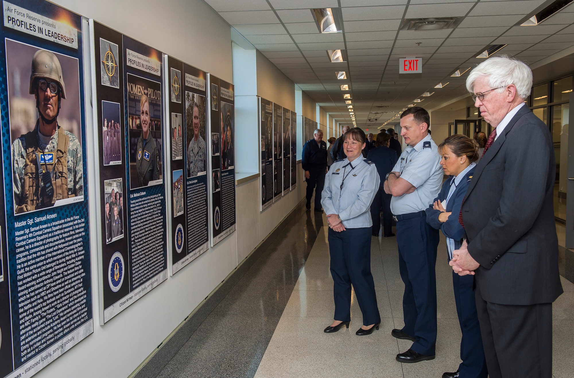 Members of the Air Force Reserve community look over the panels after the unveiling of the Profiles in Leadership display in the Pentagon, Washington D.C., Dec. 7, 2015. The display highlights outstanding examples of leadership in the Air Reserve forces, and celebrates and honors Citizen Airmen's contributions in serving the nation. (U.S. Air Force Photo/Jim Varhegyi)