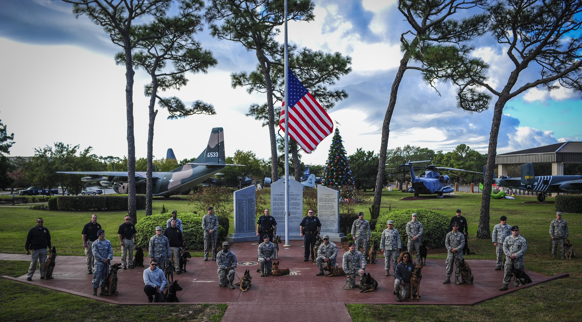 Teams participating in the Inaugural Gulf Shores Detection Showdown gather before the start of the event at Hurlburt Field, Fla., Dec. 5, 2015. Open to military and civilian K-9 units, a total of 28 teams attended the event, with some teams traveling from Wright-Patterson Air Force Base, Ohio, and Louisiana Office of State Fire Marshal. (U.S. Air Force photo by Senior Airman Meagan Schutter)