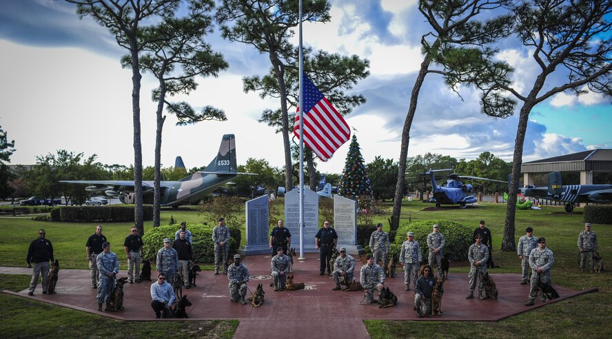 Teams participating in the Inaugural Gulf Shores Detection Showdown gather before the start of the event at Hurlburt Field, Fla., Dec. 5, 2015. Open to military and civilian K-9 units, a total of 28 teams attended the event, with some teams traveling from Wright-Patterson Air Force Base, Ohio, and Louisiana Office of State Fire Marshal. (U.S. Air Force photo by Senior Airman Meagan Schutter)