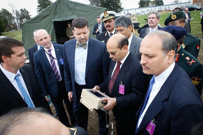 Jim Smerchansky (center), executive director of Marine Corps Systems Command, presents solar hybrid technology to an Indian delegation during a recent visit to Marine Corps Base Quantico, Virginia. The visit is part of a bilateral agreement between the two governments to further support ties under the Defense Technology and Trade Initiative. (U.S. Marine Corps photo by Jennifer Sevier)