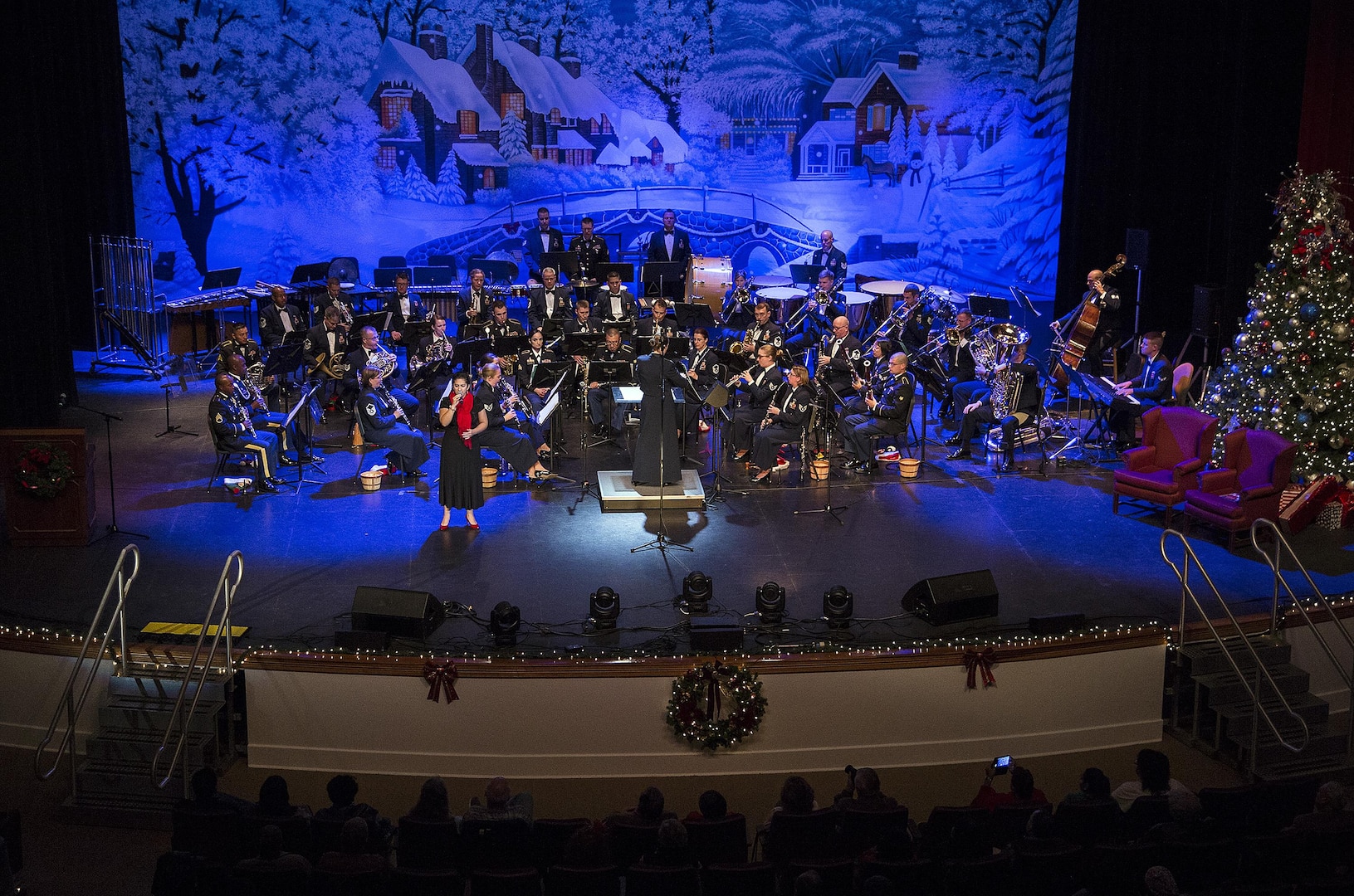 United States Air Force Band of the West performs during the Holiday in Blue concert Dec. 7, 2015 at the Edgewood Independent School District Theatre for the Performing Arts in San Antonio, Texas. The concert included a variety of holiday songs from around the world, a children’s story and a sing-a-long. Attendees included members of JBSA, community members and retirees. The Airmen assigned to the band are highly-trained professional musicians who have dedicated themselves to serving their country through music. (U.S. Air Force photo by Johnny Saldivar)