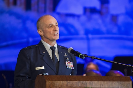 Maj. Gen. Garrett Harencak, commander, Air Force Recruiting Service, Joint Base San Antonio-Randolph, Texas, addresses the crowd during the Holiday in Blue concert Dec. 7, 2015 at the Edgewood Independent School District Theatre for the Performing Arts in San Antonio, Texas. The concert included a variety of holiday songs from around the world, a children’s story and a sing-a-long. Attendees included members of JBSA, community members and retirees. The Airmen assigned to the band are highly-trained professional musicians who have dedicated themselves to serving their country through music. (U.S. Air Force photo by Johnny Saldivar)

