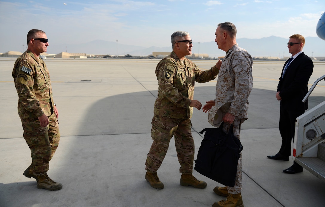 U.S. Army Gen. John Campbell, center left, commander of Resolute Support Mission and United States Forces—Afghanistan, welcomes U.S. Marine Corps Gen. Joseph F. Dunford Jr., chairman of the Joint Chiefs of Staff, on Bagram Air Field, Afghanistan, Dec. 8, 2015. U.S. Air Force photo by Staff Sgt. Tony Coronado