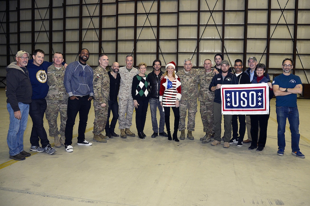 U.S. Marine Corps Gen. Joseph F. Dunford Jr., center left, chairman of the Joint Chiefs of Staff, his wife, Ellyn, U.S. Army Gen. John Campbell, center right, commander of Resolute Support Mission and United States Forces—Afghanistan, U.S. Army Maj. Gen. Jeffrey Bannister, Command Sgt. Maj. Delbert Byers, and Command Sgt. Maj. Rodney "Ray" Lewis, joined the USO Tour group which includes USO President J.D. Crouch, Kristen Crouch, actress Elizabeth Banks, recording artist Chris Daughtry, Kyle Jacobs, Brett James, Billy Montana, David Wain, Heath Hembree, Sydney Castillo and Steven Wright on Bagram Airfield, Afghanistan, Dec. 8, 2015. U.S. Air Force photo by Staff Sgt. Tony Coronado