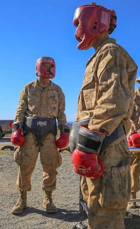 Private Robert J. Bailey, Platoon 3267, Mike Company, 3rd Recruit Training Battalion, watches his opponent during body boxing at Edson Range, Weapons and Field Training Battalion, Marine Corps Base Camp Pendleton, Calif., Dec. 2. To ensure their safety, recruits were given protective gear to help shield them from certain strikes from their opponent. Recruits were matched up with someone around the same weight they were, give or take 10 pounds.