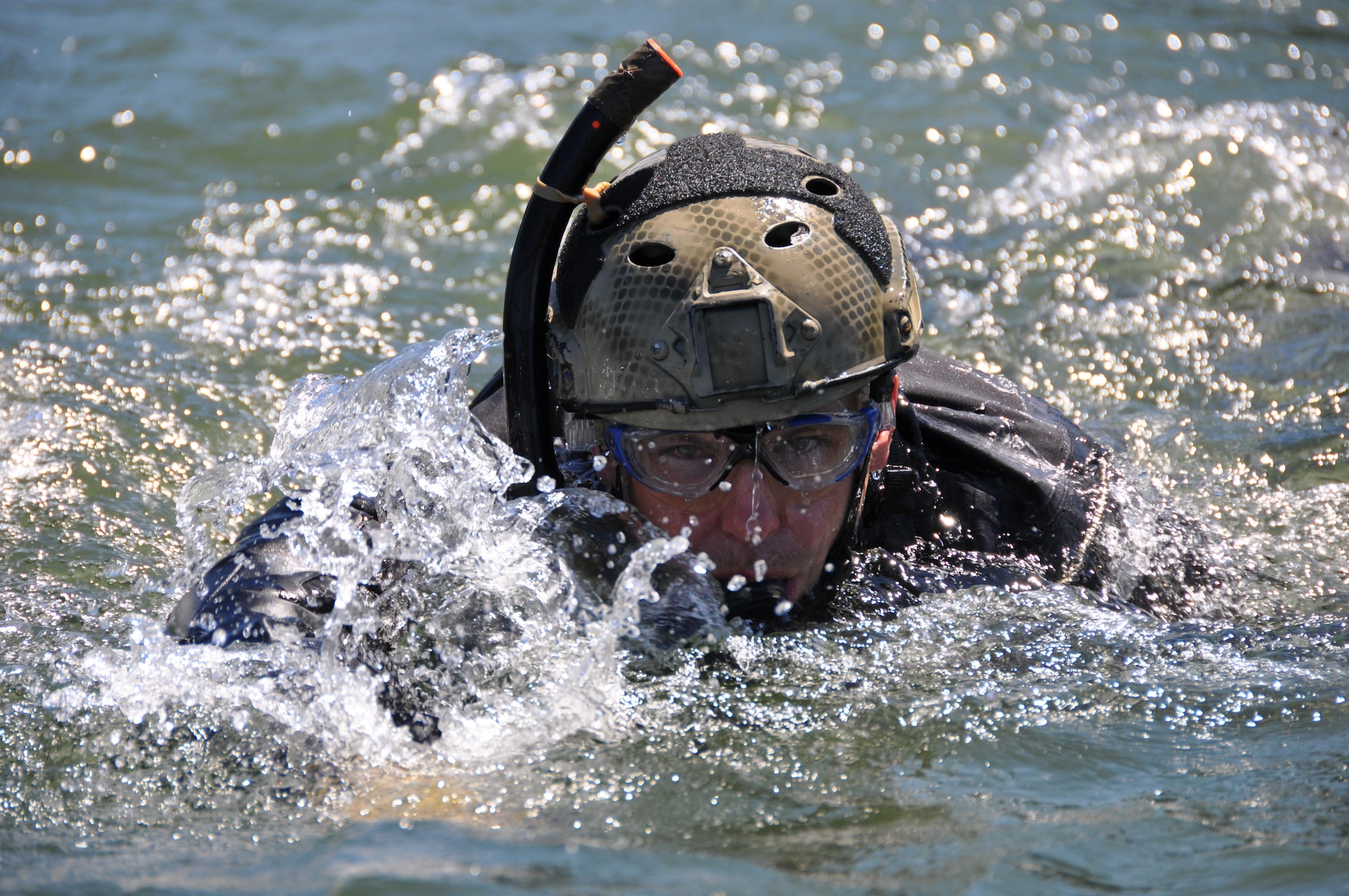 Air Force Reserve Tech. Sgt. Lucas Martin, a pararescueman from the 304th Rescue Squadron, Portland International Airport, Oregon, participates in water rescue training in the Columbia River, near Rooster Rock State Park, Oregon, July 27, 2013. Pararescuemen from the 304th RQS regularly conduct water training to be ready to rescue in any environment. Combat rescue officers and PJs go through the same initial training pipeline before joining a search and rescue unit.