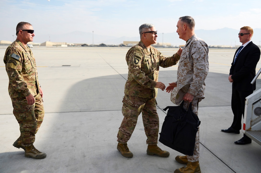 U.S. Army Gen. John Campbell, center left, commander of Resolute Support Mission and United States Forces—Afghanistan, welcomes U.S. Marine Corps Gen. Joseph F. Dunford Jr., chairman of the Joint Chiefs of Staff, on Bagram Air Field, Afghanistan, Dec. 8, 2015. U.S. Air Force photo by Staff Sgt. Tony Coronado