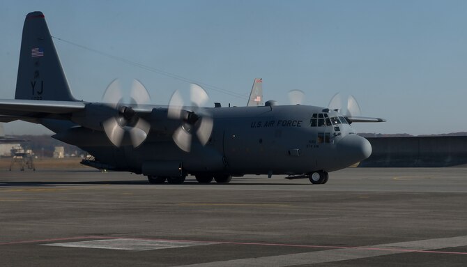 A C-130 Hercules prepares to leave for Andersen Air Force Base, Guam, in support of Operation Christmas Drop 2015, at Yokota Air Base, Japan, Dec. 7, 2015. Over 40,000 pounds of goods will be dropped to 56 islands throughout the Commonwealth of the Northern Marianas, Federated States of Micronesia and Palau. (U.S. Air Force photo by Senior Airman David C. Danford/Released)