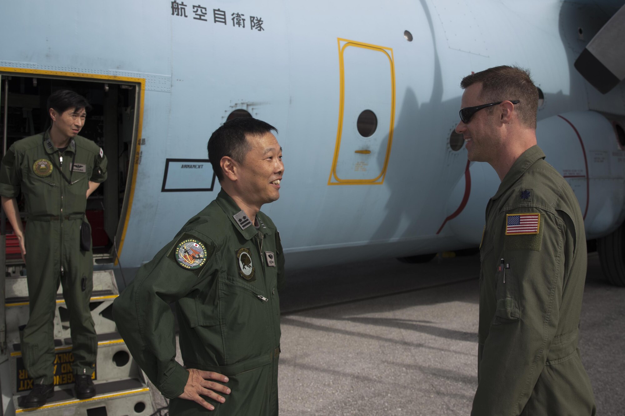 (Right to left) U.S. Air Force Lt. Col. John Kerr, 36th Airlift Squadron director of operations, greets Japan Air Self-Defense Force Lt. Col. Ken Ikemori, 401st Squadron commander, at Andersen Air Force Base, Guam, Dec. 4, 2015. Operation Christmas Drop is a humanitarian aid/disaster relief training event where C-130 aircrews perform low-cost low-altitude airdrops on unsurveyed drop zones while providing critical supplies to 56 islands throughout the Commonwealth of the Northern Marianas, Federated States of Micronesia and Republic of Palau. It highlights the U.S. and allied airpower capabilities to orient and respond to activities in peacetime and crisis. In addition to delivering critical supplies to those in need, Operation Christmas Drop provides specific training to U.S. and allied aircrews, enabling theater-wide airpower. (U.S. Air Force photo by Osakabe Yasuo/Released)