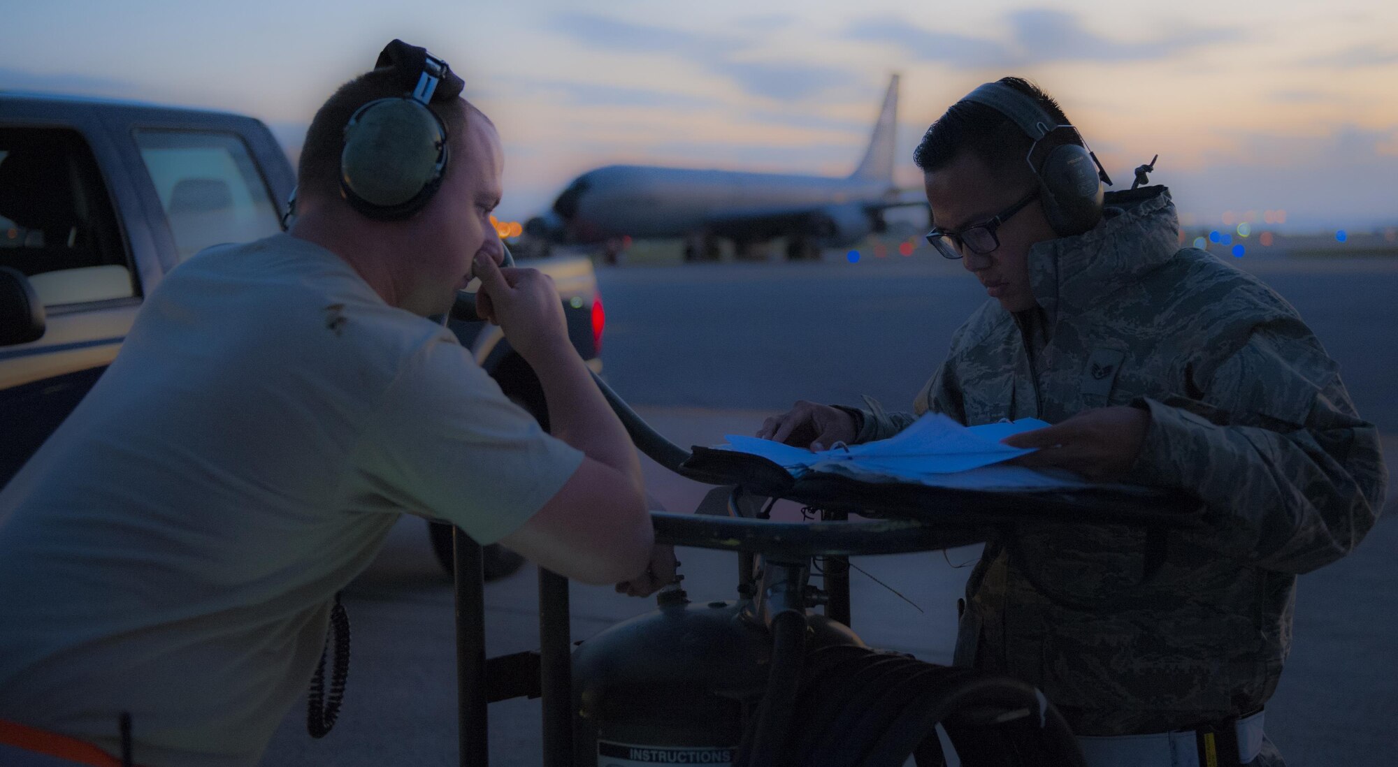 U.S. Air Force Staff Sgt. Chirstopher Anderson (left), 909th Aircraft Maintenance Unit crew chief, undergoes an active forms review from Staff Sgt. Andre Pagtalunan, 18th Maintenance Group quality assurance inspector Dec. 7, 2015, on Kadena Air Base, Japan. When conducted, the inspection ensures a high quality of work and safety for the Airmen on the flightline. (U.S. Air Force photo by Airman Zackary A. Henry)