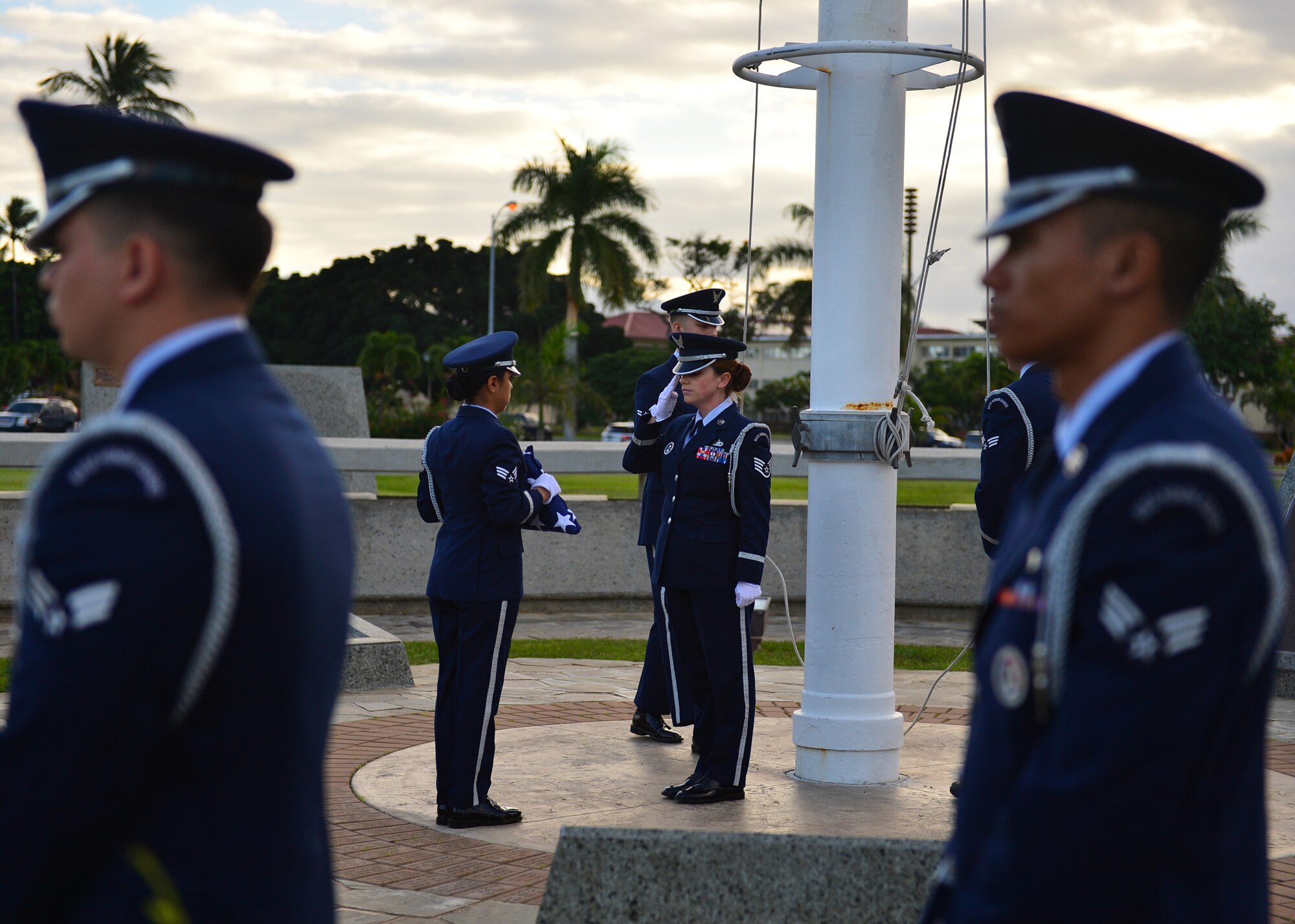 Members of the Hickam Honor Guard perform flag detail during the 74th attack on Hickam Field Remembrance Ceremony hosted by the 15th Wing on Joint Base Pearl Harbor-Hickam, Hawaii, Dec. 7, 2015. Survivors and their family members attended the ceremony, which honors the men and women who lost their lives on Hickam Field during the two waves of attacks launched by the Imperial Japanese Navy on Dec. 7, 1941. (U.S. Air Force photo by Tech. Sgt. Aaron Oelrich/Released) 