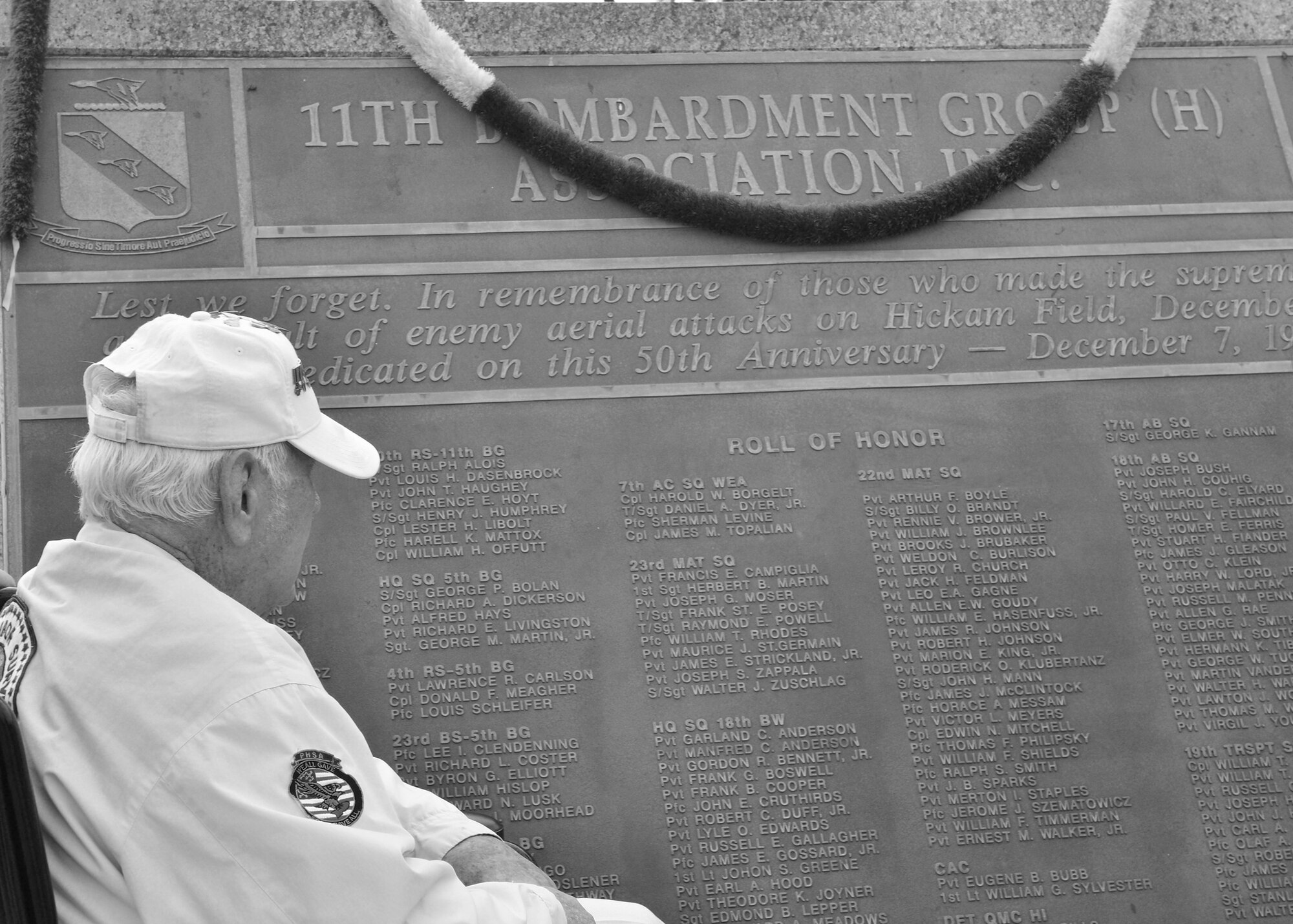 Durward Swanson looks for his former commander on the 7 December Memorial Plaque after participating in the 74th Remembrance Ceremony hosted by the 15th Wing on Joint Base Pearl Harbor-Hickam, Hawaii, Dec. 7, 2015. Survivors and their family members attended the ceremony, which honors the men and women who lost their lives on Hickam Field during the two waves of attacks launched by the Imperial Japanese Navy on Dec. 7, 1941. (U.S. Air Force photo by Tech. Sgt. Aaron Oelrich/Released) 
