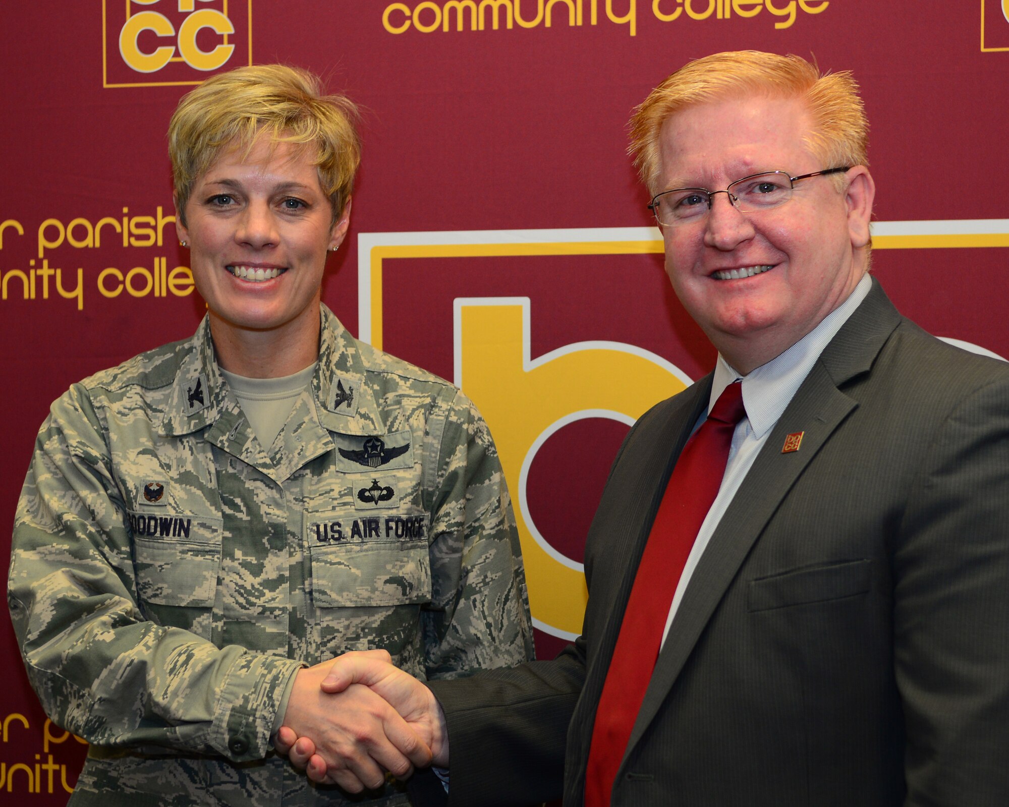 Col. Kristin Goodwin, 2nd Bomb Wing commander, and Rick Bateman Jr., Bossier Parish Community College chancellor, sign a proclamation giving Airmen and their families a chance to attend sports and performing arts events free of charge at BPCC, Dec. 4, 2015. During the signing, Goodwin spoke to BPCC students about the 2nd Bomb Wing's priorities of people, mission and pride, and how they align with BPCC's goal of empowering students and Airmen.
