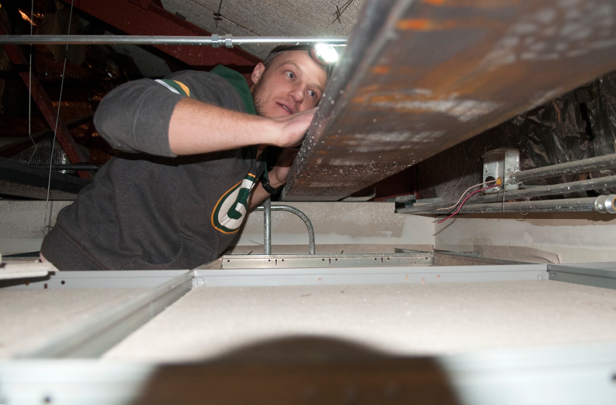 Bob Ziolkowski, Simpsons Electric contractor, upgrades the fire alarm system in the Trail’s End Event Center on F.E. Warren Air Force Base, Wyo., Dec. 7, 2015. Several contracting companies are renovating the center with a deadline for completion in the summer of 2016. (U.S. Air Force photo by Airman 1st Class Malcolm Mayfield)
