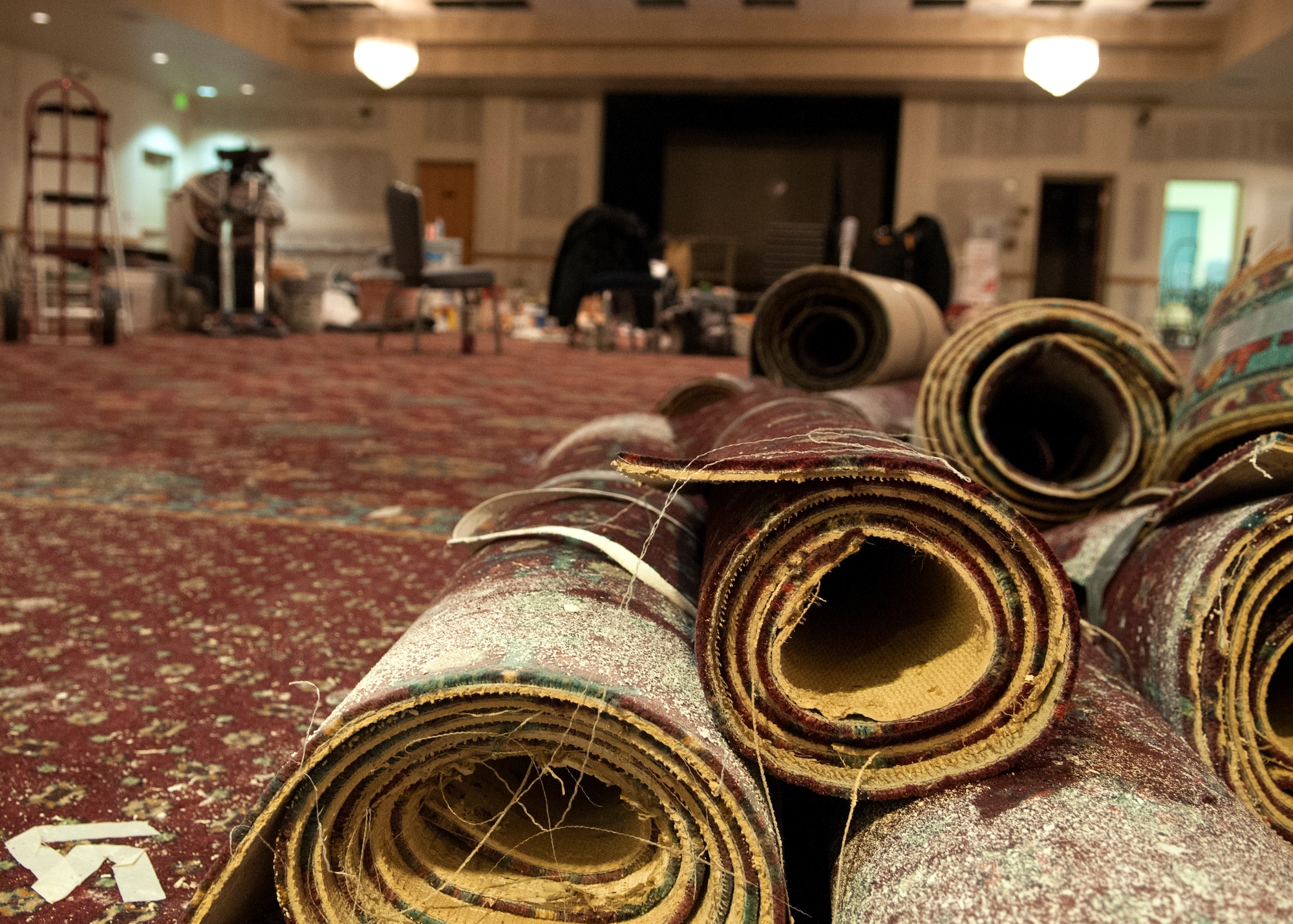 Old carpet removed from the Trail’s End Event Center lays on the floor Dec. 7, 2015, on F.E. Warren Air Force Base, Wyo. Approximately $180,000 was approved for revitalizing the center. New carpets and wall upgrades, among other renovations, will be completed to give the center a new feel. (U.S. Air Force photo by Airman 1st Class Malcolm Mayfield)