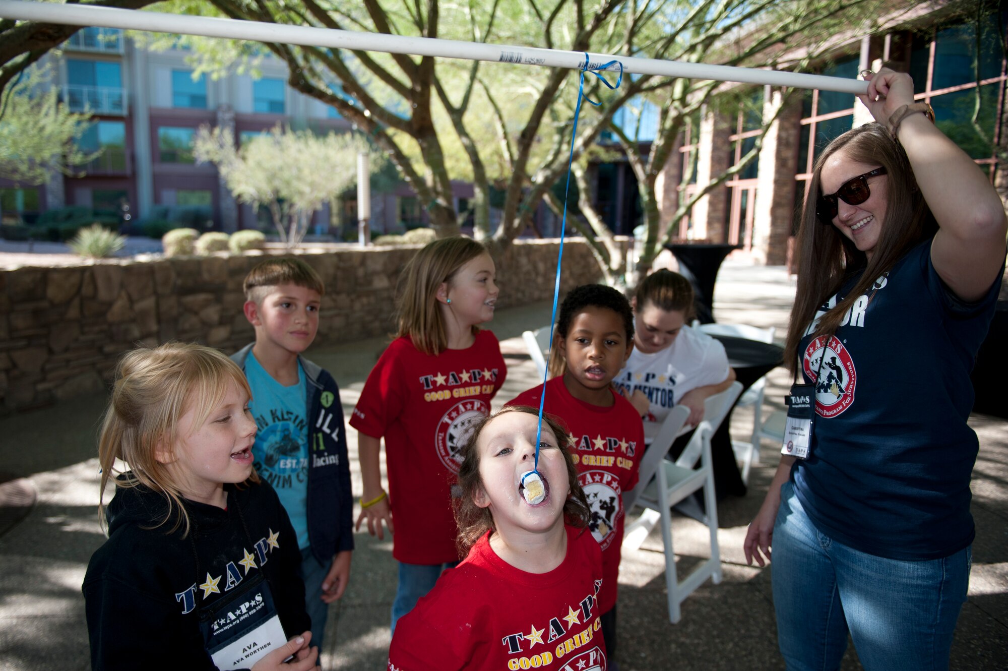 Senior Airman Christina Varland, 56th Component Maintenance Squadron administration specialist, participates as a mentor for the Transition Assistance Program for Survivors camp in Scottsdale, Arizona Dec. 5, 2015. TAPS is different from other grief programs in that the directors make a point to match the children with active-duty mentors. (U.S. Air Force photo by Staff Sgt. Staci Miller)