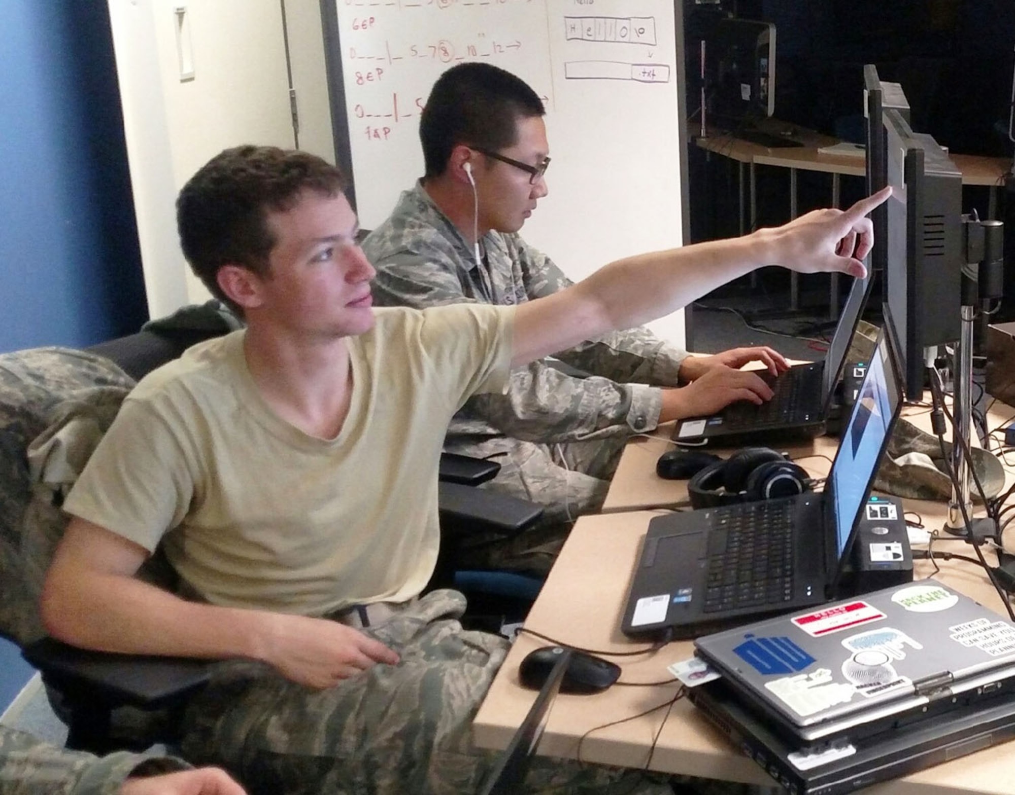 Cadet 2nd Class Austin McWhirter points out potential systems vulnerabilities during the University of Santa Barbara at California’s International Capture the Flag Cyber Competition Dec. 4. The Air Force Academy Cyber Competition Team placed second out of 12 U.S. teams and ninth overall in the competition. (U.S. Air Force photo)