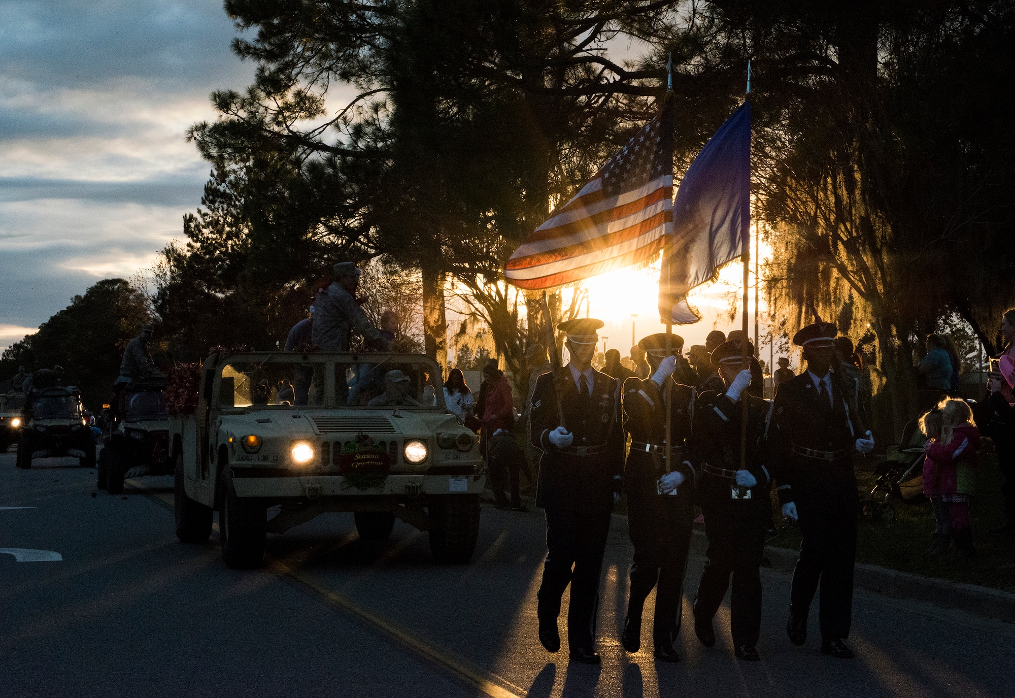 The Moody Air Force Base Honor Guard leads the parade at the annual tree lighting ceremony, Dec. 4, 2015. The parade featured leadership and groups from Moody, organizations from the local community, and Mr. and Mrs. Claus. (U.S. Air Force photo by Airman 1st Class Lauren M. Johnson/Released)