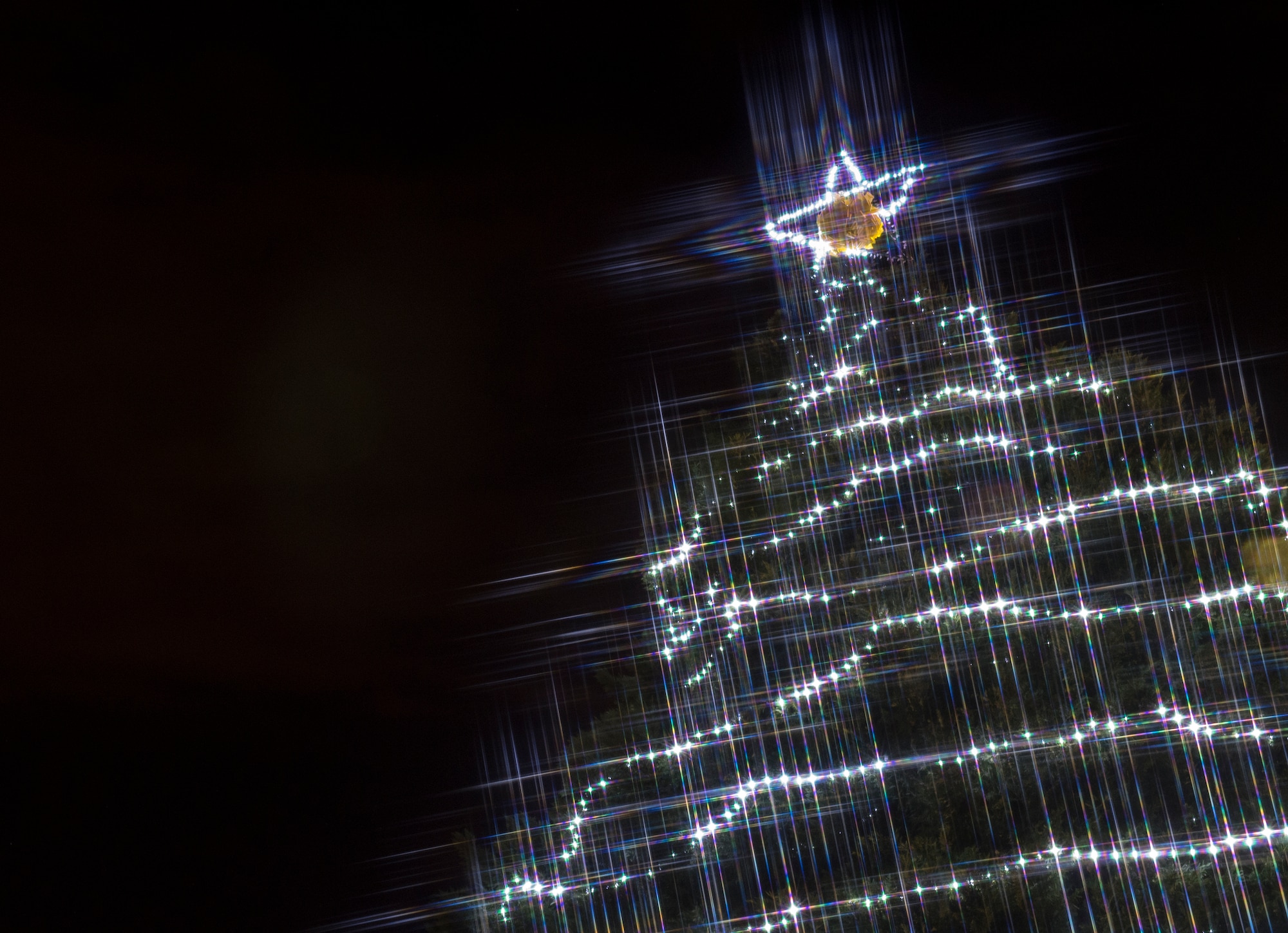 A tree shines in bright light, Dec. 4, 2015, at Moody Air Force Base, Ga. The base held a tree lighting ceremony and hosted a parade, a meet and greet with Mr. and Mrs. Claus, and children got to play in real snow made by a machine. (U.S. Air Force photo/Tech. Sgt. Zachary Wolf)