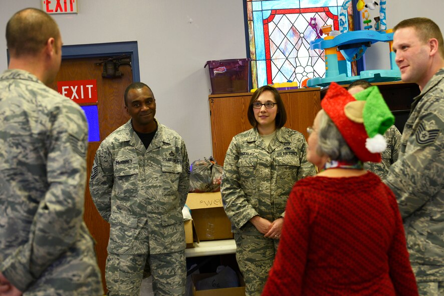 U.S. Air Force Chief Master Sgt. Christopher McKinney, 20th Fighter Wing command chief, converses with volunteers at the Palmetto Chapel at Shaw Air Force Base, S.C., Dec. 4, 2015. McKinney made a visit to the Palmetto Chapel to show his support for Operation True Giving and what it provides for the Shaw and Sumter community. (U.S. Air Force photo by Airman 1st Class Christopher Maldonado)
