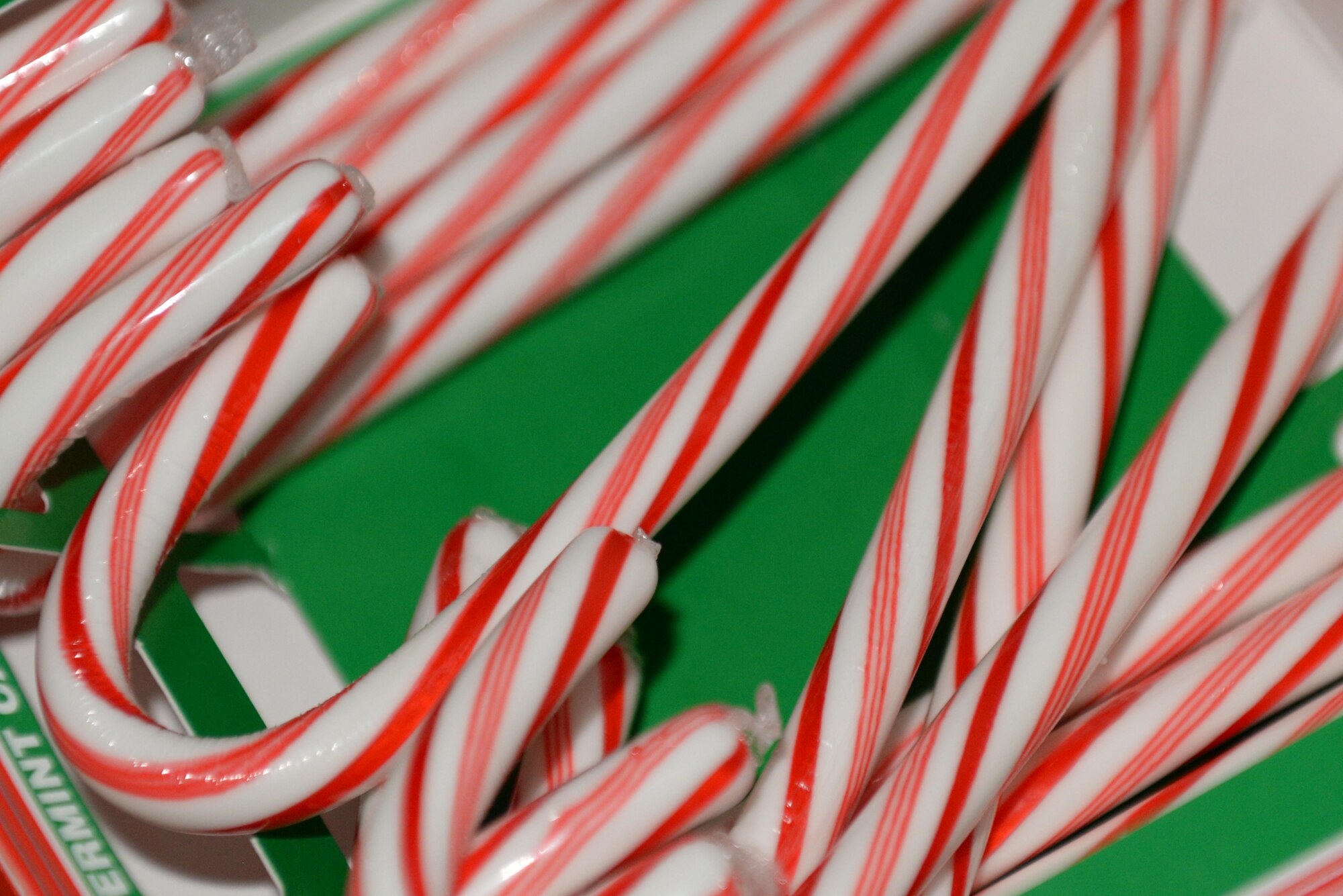 Candy canes are given out to children during the base tree lighting ceremony, Dec. 7, 2015, at Seymour Johnson Air Force Base, North Carolina. Children received a candy cane after they were photographed with Santa. (U.S. Air Force photo/Airman 1st Class Ashley Williamson)