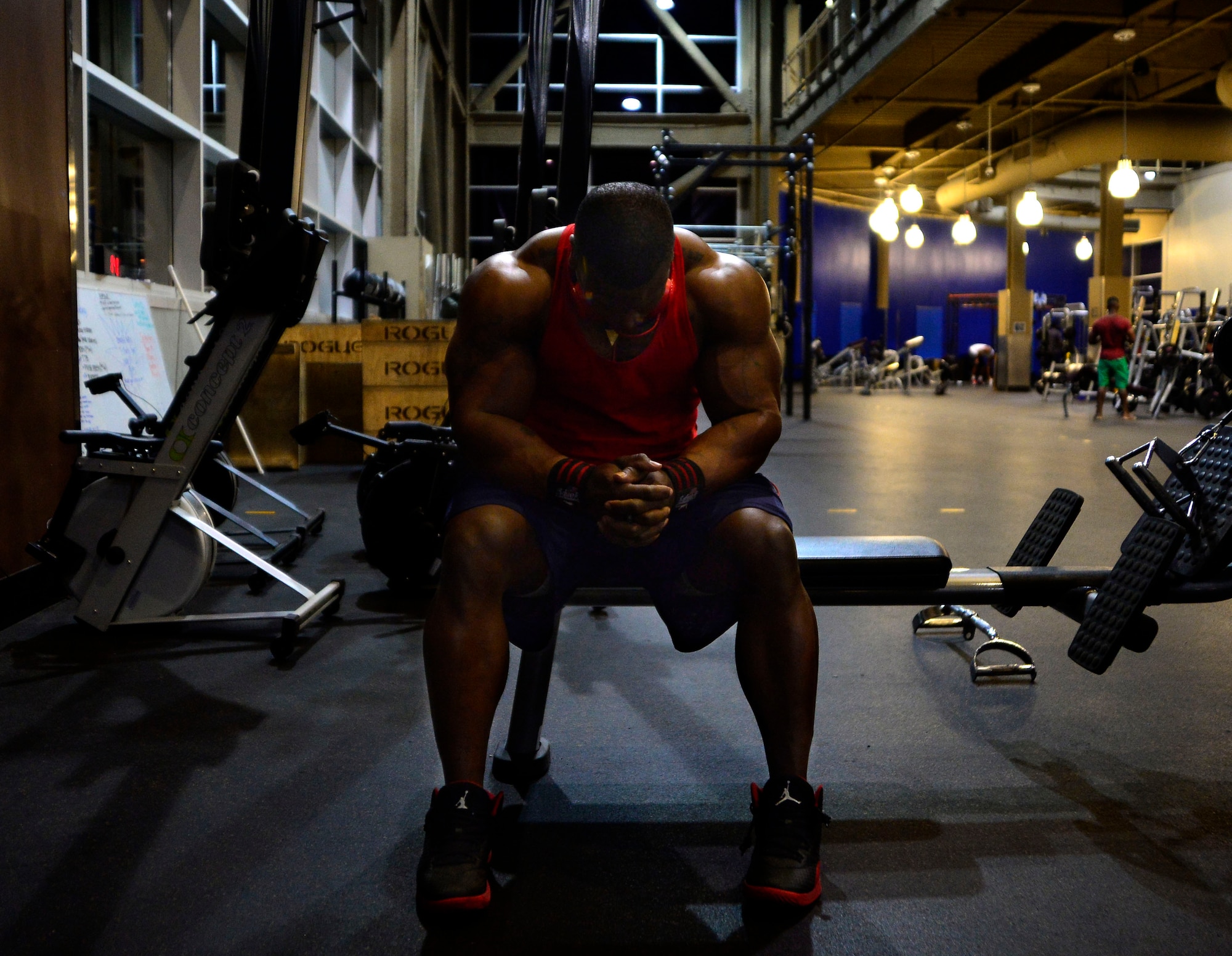 Tech. Sgt. David, 432nd Maintenance Group contract officer representative, rests during a workout Dec. 4, 2015, at Nellis Air Force Base, Nevada. David is a professional bodybuilder in the International Federation of Bodybuilding and Fitness. (U.S. Air Force photo by Airman 1st Class Christian Clausen/Released)