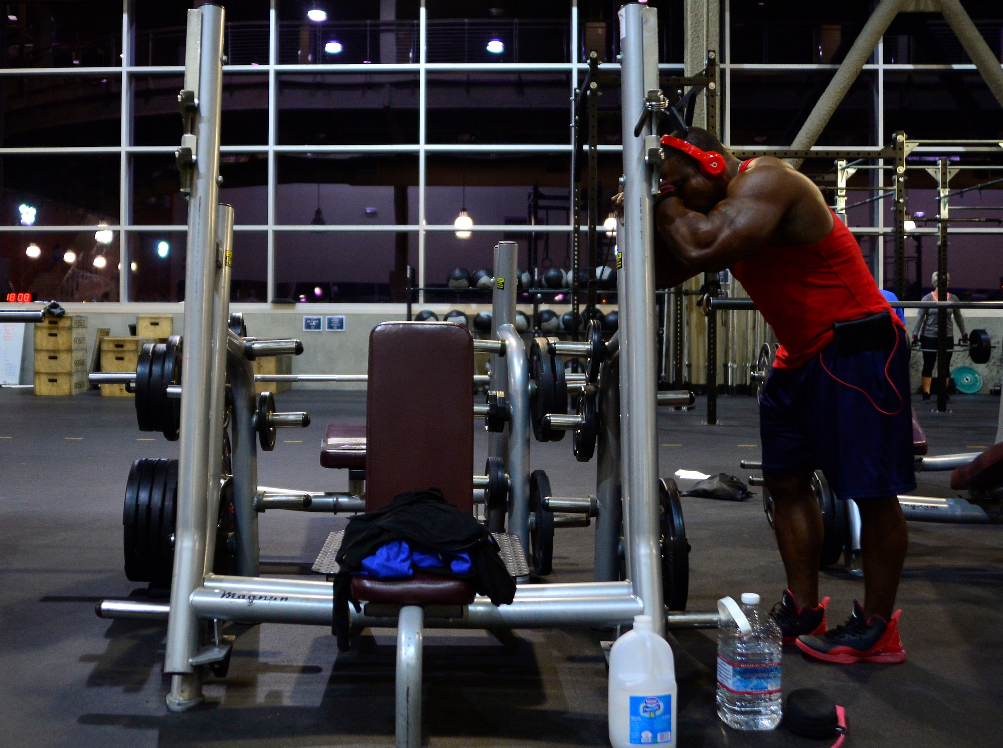 Tech. Sgt. David, 432nd Maintenance Group contract officer representative, rests during a workout Dec. 4, 2015, at Nellis Air Force Base, Nevada. David is a professional bodybuilder in the International Federation of Bodybuilding and Fitness. (U.S. Air Force photo by Airman 1st Class Christian Clausen/Released)