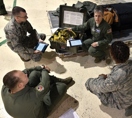 WRIGHT-PATTERSON AIR FORCE BASE, Ohio—Maj. Shari Ellis, a flight nurse with the 445th Aeromedical Evacuation Squadron, trains squadron members on the use of electrical cables during the Nov. 15, 2015 unit training assembly. Ellis and other member of the squadron were undergoing “Hands-on Equipment Review” with medical and other equipment used by the technicians and nurses during medical evacuation missions. The training is an annual requirement for the flyers and helps them refresh on safety while using the equipment in flight. (U.S. Air Force photo/Tech. Sgt. Frank Oliver)