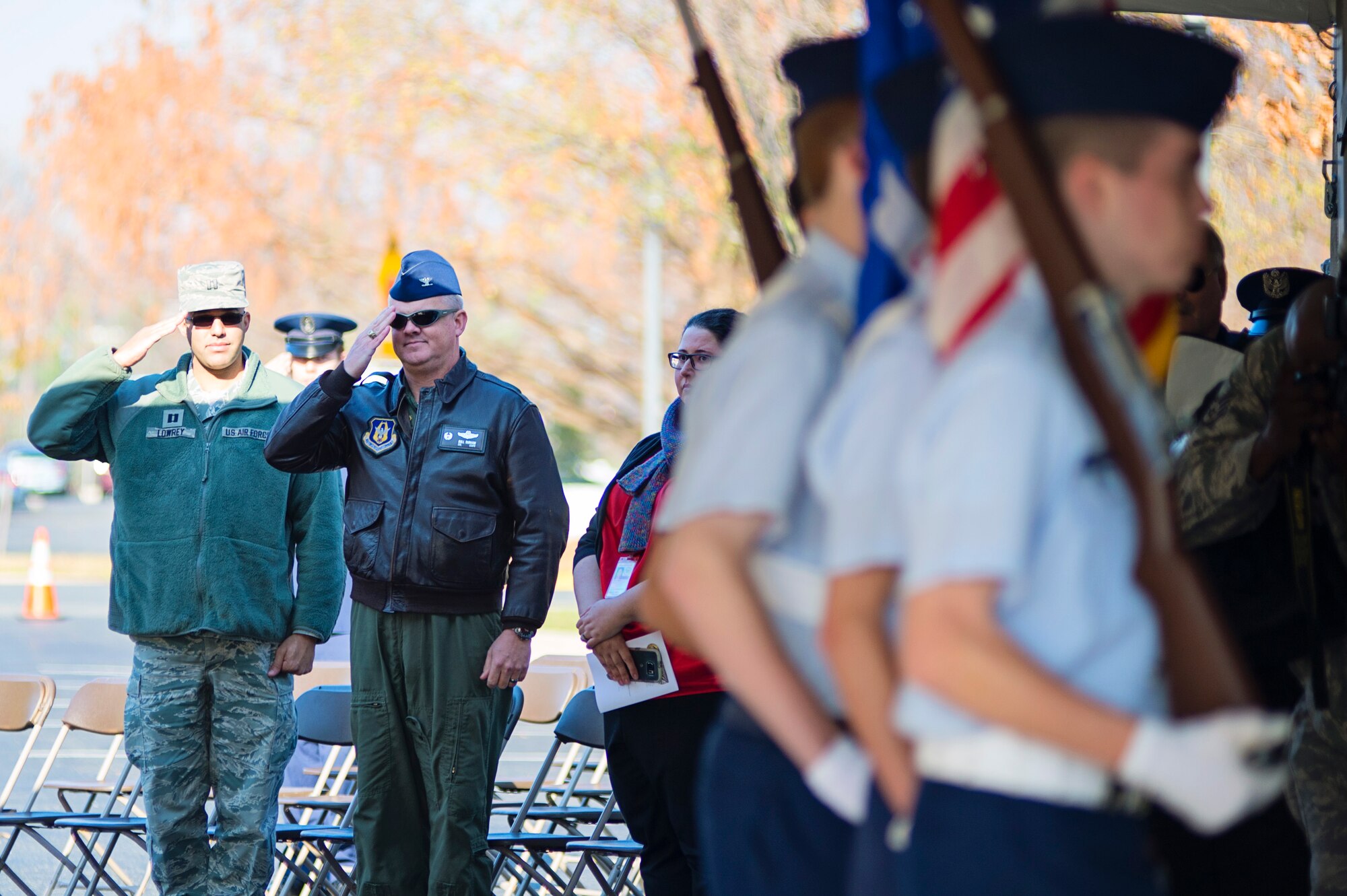 Col. Scott Durham (center), 512th Airlift Wing commander, alongside his executive officer Capt. Jason Lowrey, salute during the National Anthem at the Wreaths Across America ceremony December 7 in Dover, Del. Durham represented Team Dover at the event that was also attended by Delaware National Guard Adjutant General, Maj. Gen. Frank Vavala. (U.S. Air Force photo/Capt. Bernie Kale)
