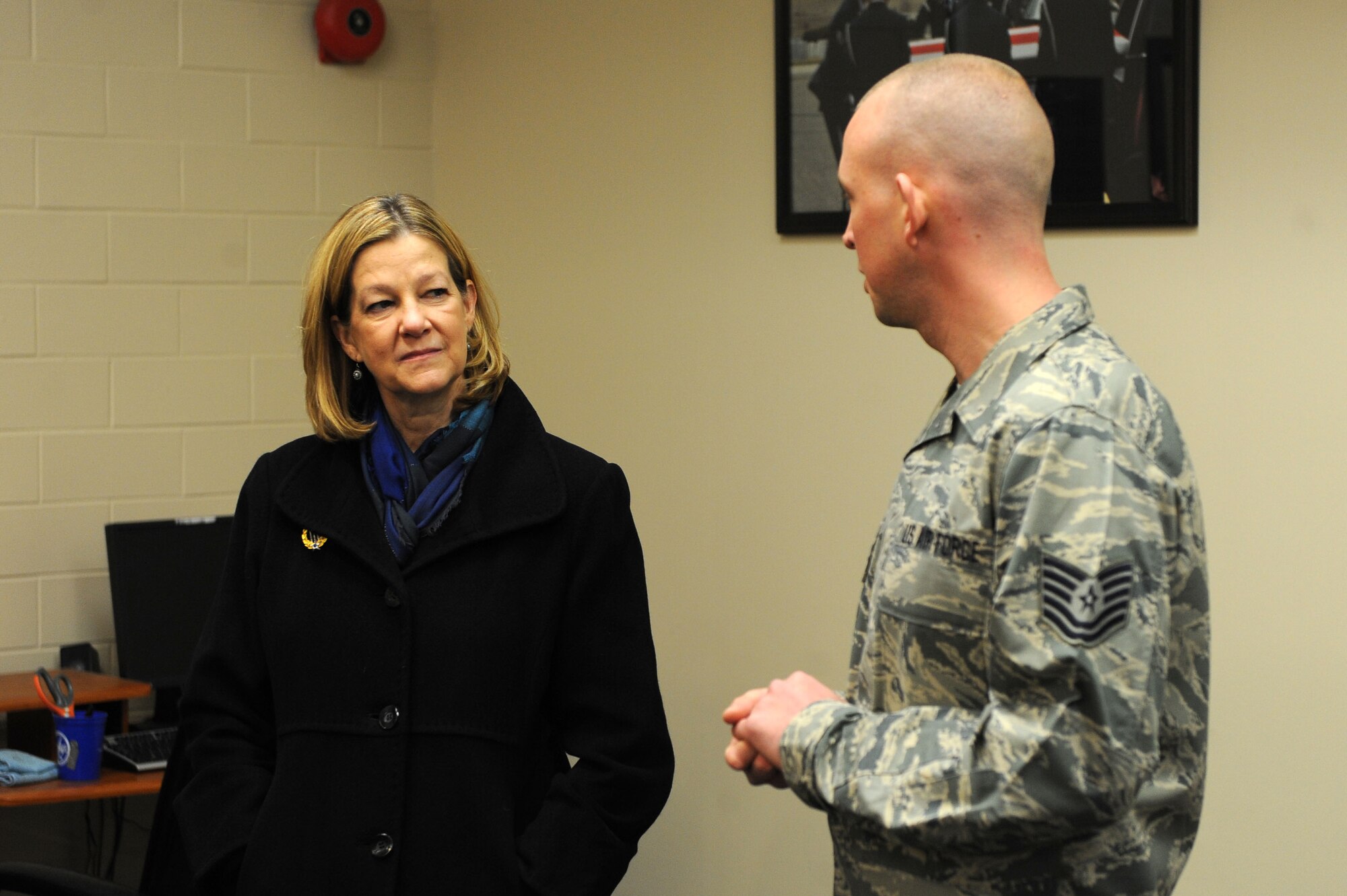 Kim Rand, wife of AFGSC commander Gen. Robin Rand, talks with Tech. Sgt. Joshua Hull, 5th Force Support Squadron non-commissioned officer in charge of Minot AFB’s Honor Guard. During her visit, Mrs. Rand toured the child development center, elementary schools, youth center and other base facilities that support the base’s families. (U.S. Air Force photo/Senior Airman  Kristoffer Kaubisch)