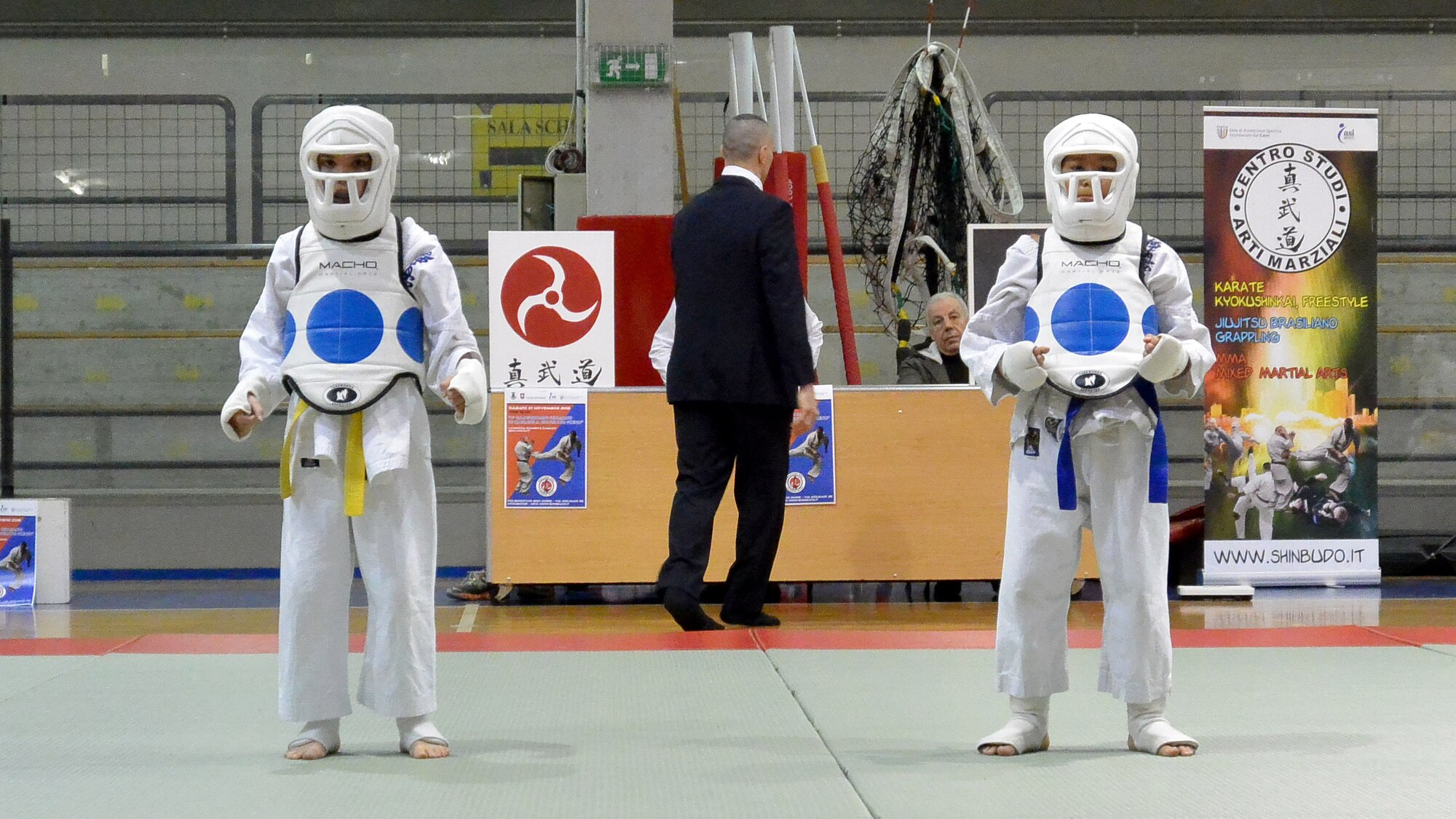 Airic Jack (right), son of Tech. Sgt. Isaac Jack, stands victorious after defeating his opponent in a karate match during a karate tournament Nov. 21, 2015, in Pordenone, Italy. Jack won the bronze medal during the tournament. (Courtesy photo)