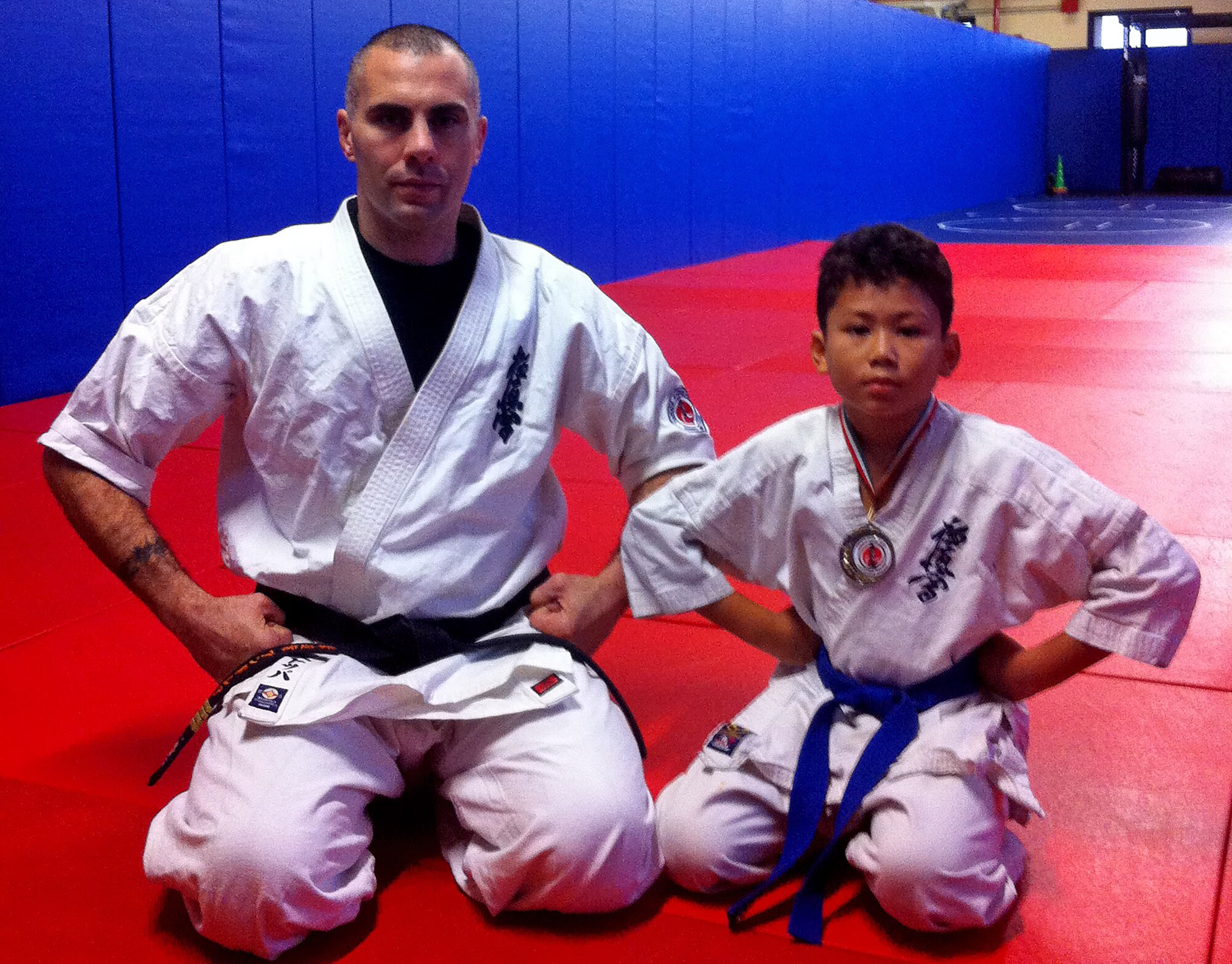 Airic Jack (right), son of Tech. Sgt. Isaac Jack, poses with his karate sensei, Andrea Stoppa, Nov. 25, 2015, at Aviano Air Base, Italy. Jack was awarded the bronze medal for coming in third place during a karate tournament Nov. 21, 2015 in Pordenone, Italy. (Courtesy photo)
