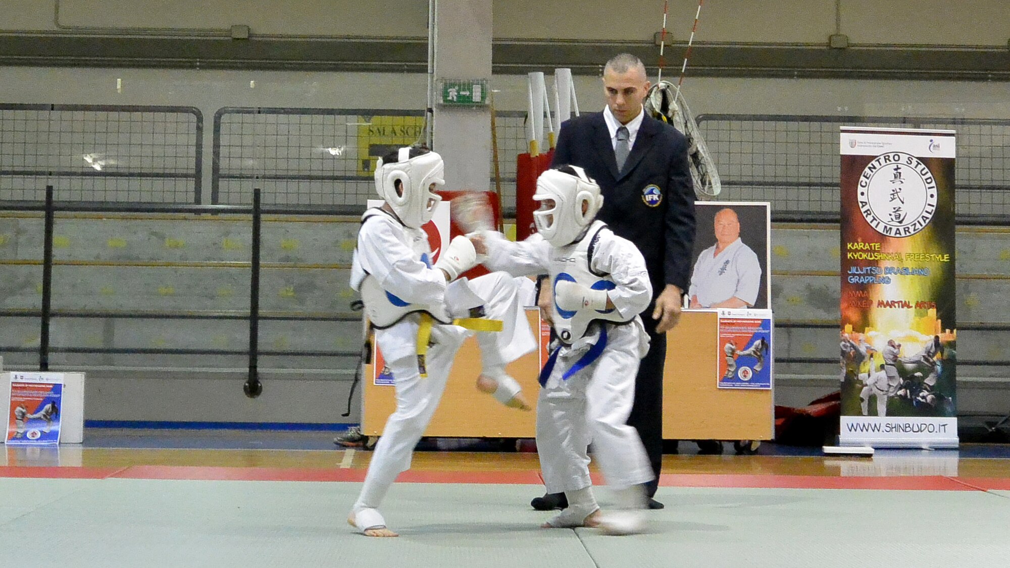 Airic Jack (right), son of Tech. Sgt. Isaac Jack, strikes his opponent during a karate tournament Nov. 21, 2015, in Pordenone, Italy. Jack won the bronze medal during the tournament. (Courtesy photo)