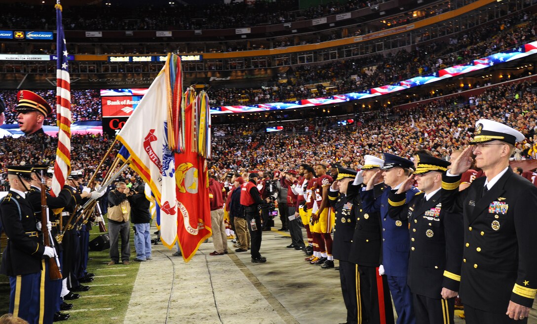 Air Force District of Washington Commander Maj. Gen. Darryl Burke joins his counterparts from Joint Force Headquarters-National Capital Region to honor the nation’s colors during pre-game activities for the Washington Redskins versus Dallas Cowboys game, Dec. 7, 2015 at FedEx Field in Landover, Md. The Washington Redskins continued their tradition of honoring the nation's veterans and active duty military through the team's annual Salute to Service game. (U.S. Air Force photo by James E. Lotz/RELEASED).