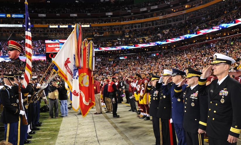 Air Force District of Washington Commander Maj. Gen. Darryl Burke joins his counterparts from Joint Force Headquarters-National Capital Region to honor the nation’s colors during pre-game activities for the Washington Redskins versus Dallas Cowboys game, Dec. 7, 2015 at FedEx Field in Landover, Md. The Washington Redskins continued their tradition of honoring the nation's veterans and active duty military through the team's annual Salute to Service game. (U.S. Air Force photo by James E. Lotz/RELEASED).