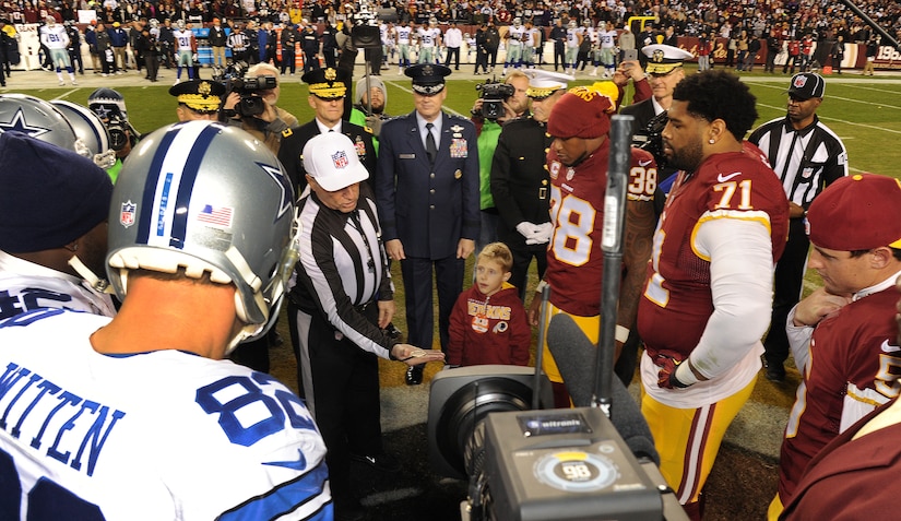 LeBron James tosses the football before the beginning of the game as the Dallas  Cowboys faced the Washington Redskins at FedEx Field in Landover, Maryland,  Sunday, September 12, 2010. (Photo by Ron