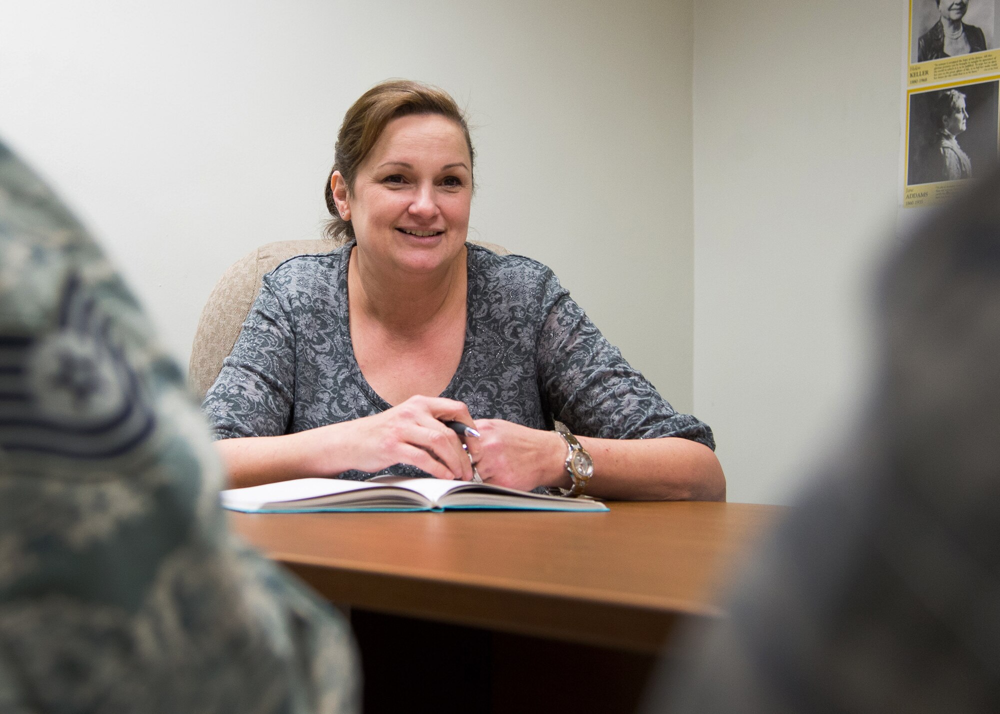 Wendy Reyes, the 66th Air Base Group Equal Opportunity director, meets with members of the EO office in Building 1217 Dec. 8. Reyes has worked in numerous positions within the EO community throughout her 20 year career. (U.S. Air Force photo by Mark Herlihy)