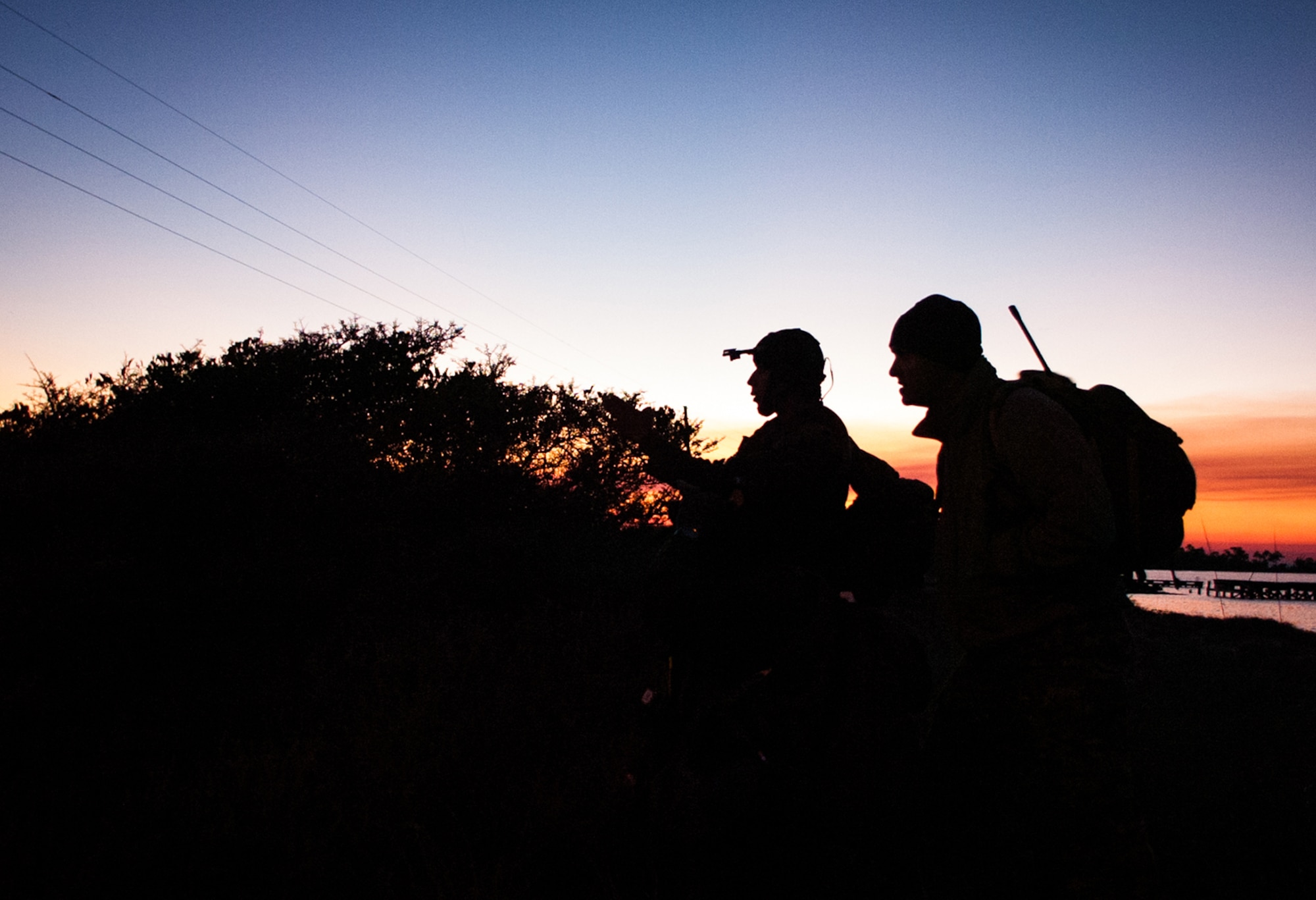 A member of the Colombian Compañía Jungla Antinarcóticos, left, briefs a Special Forces soldier assigned to the 7th Special Forces Group (Airborne), his plan to assault an objective on Santa Rosa Island on November 23.  The Junglas, as they are known, were participating in a culmination exercise hosted by the Green Berets and designed to test their proficiency in close quarters combat as well as mission planning.  The Junglas spent most of November on Eglin AFB training with the Special Forces soldiers as part of the Western Hemisphere’s longest enduring security partnership formed to counter narcotic and human trafficking.  (U.S. Army photo/Maj. Thomas Cieslak)