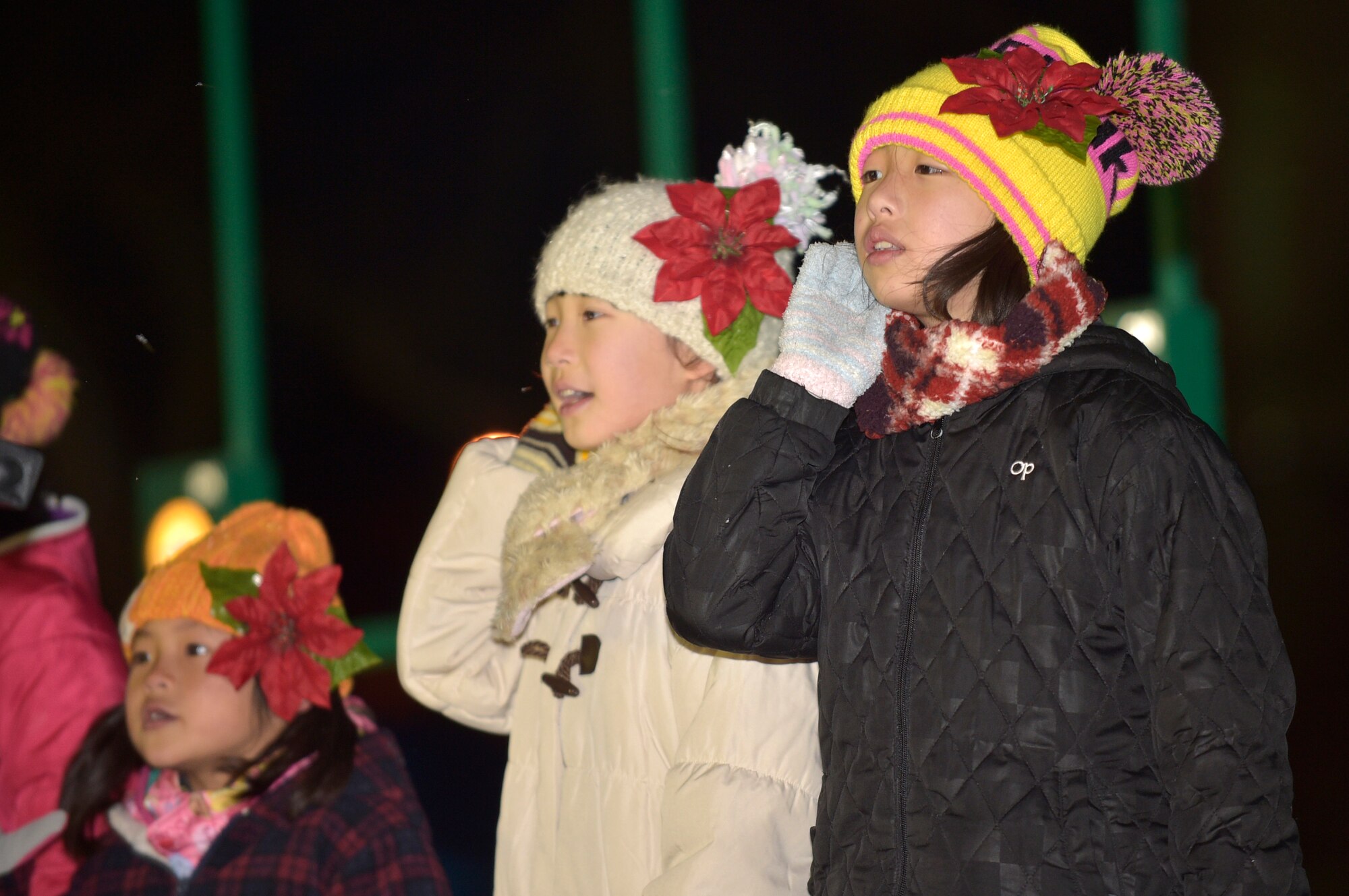 Misawa City English students perform a holiday carol during the annual Holiday Tree Lighting Ceremony at Misawa Air Base, Japan, Dec. 4, 2015. Members of the local community and Japan Air Self-Defense Force were also present at the ceremony, providing them a glimpse of American traditions during the holiday season. (U.S. Air Force photo by Senior Airman Jose L. Hernandez-Domitilo)