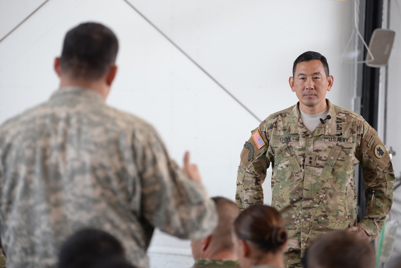 U.S. Army Maj. Gen. K.K. Chinn, Army South commander, listens to a question asked by a Soldier stationed at Soto Cano Air Base, Honduras, Dec. 8, 2015. Chinn came to Soto Cano for Soldiers to ask questions about ARSOUTH operations and to better explain the big picture of why they are here. (U.S. Air Force photo by Senior Airman Westin Warburton/Released)